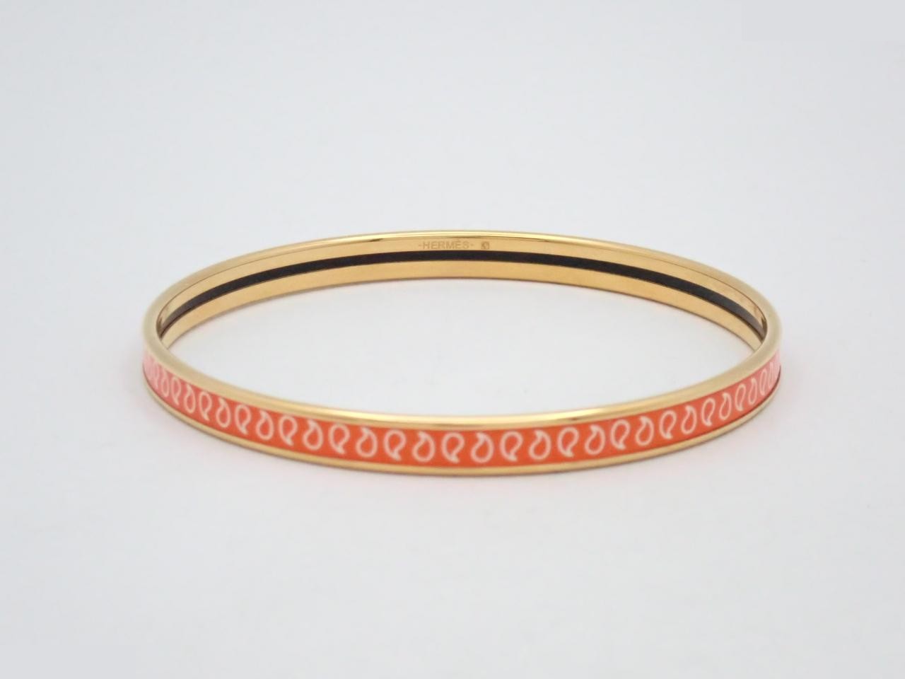 Uni-brand enamel bracelet in orange and gold, wrist circumference approximately 19cm. — view 2