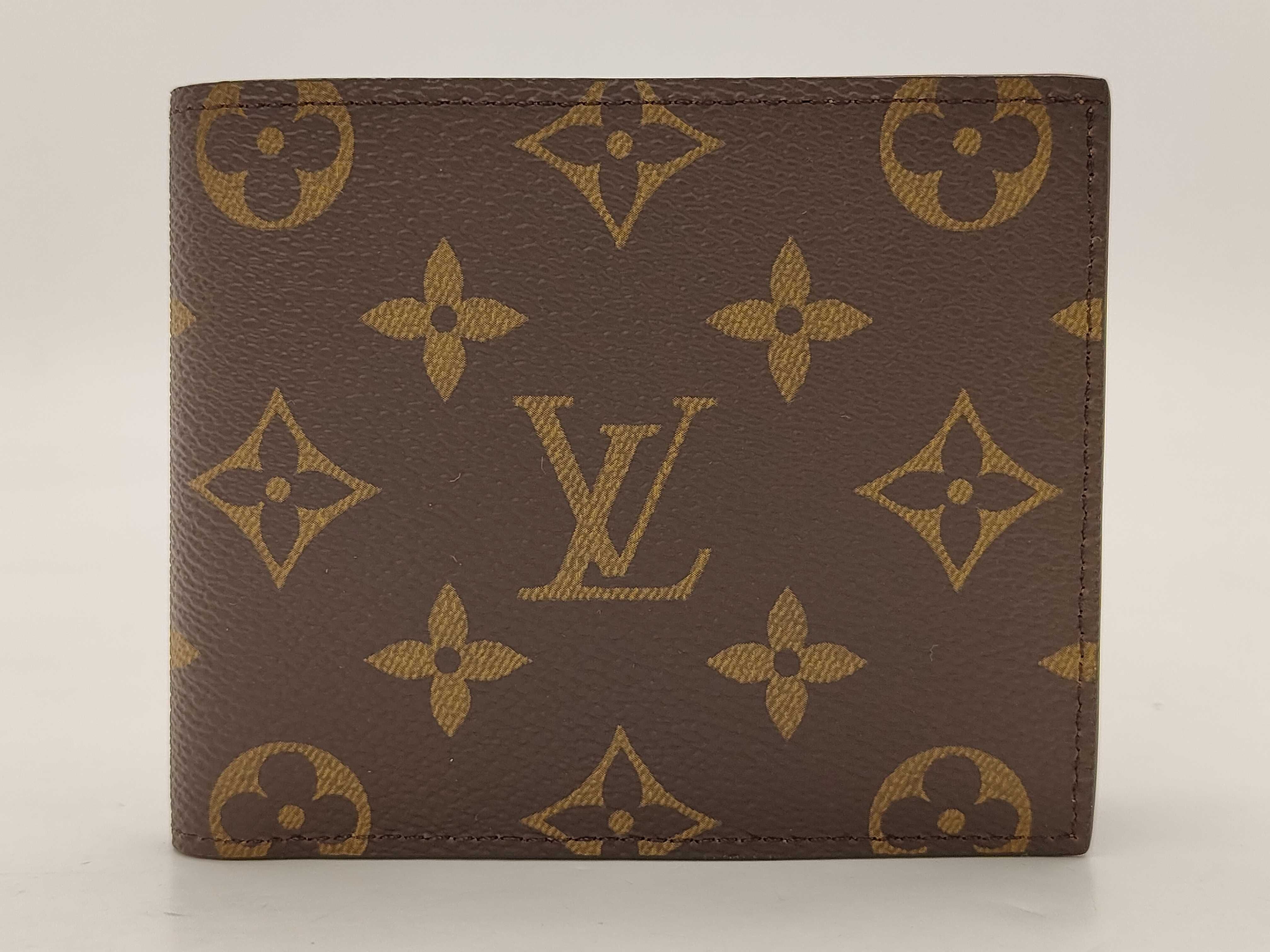 Monogram Zippy Wallet Embossed Wallet