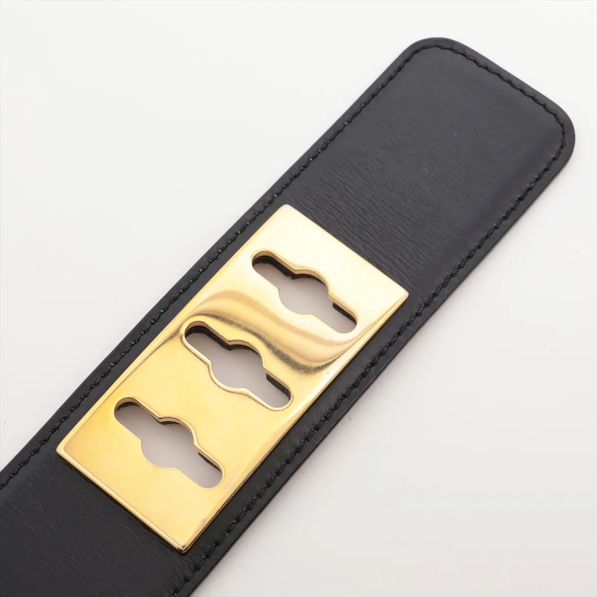 logo belt, size 65, GP leather, black and gold. Shows signs of wear, including — view 3