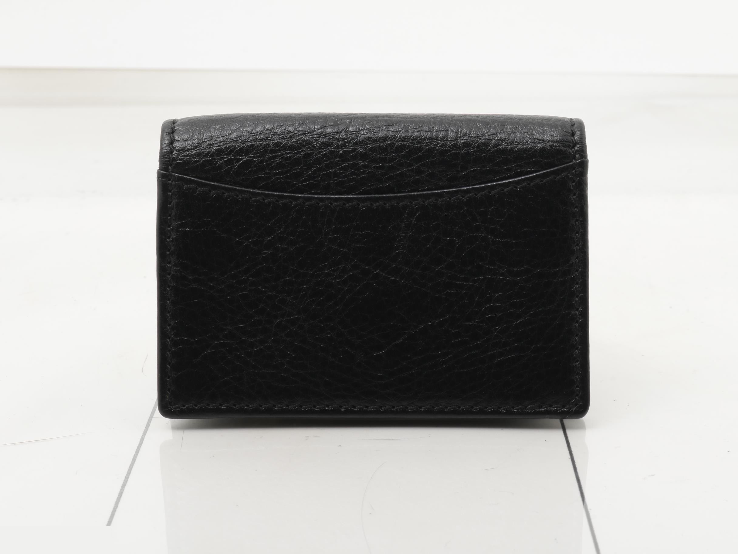 Leather card case with gold hardware. — view 2