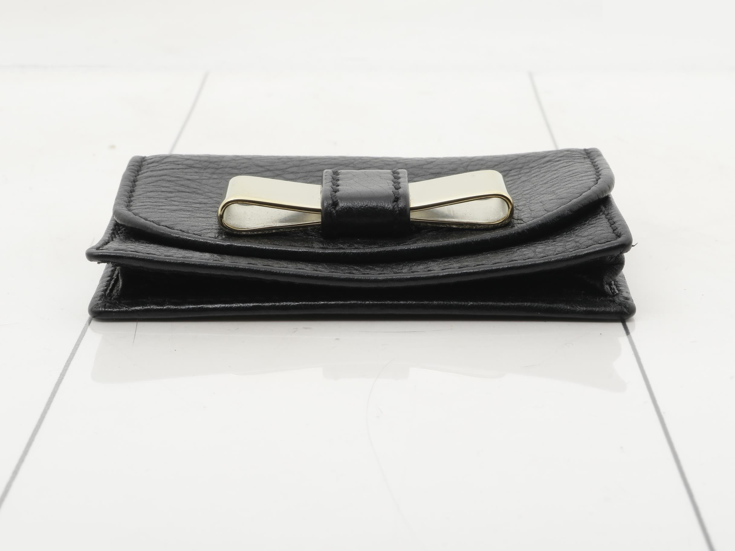 Leather card case with gold hardware. — view 3