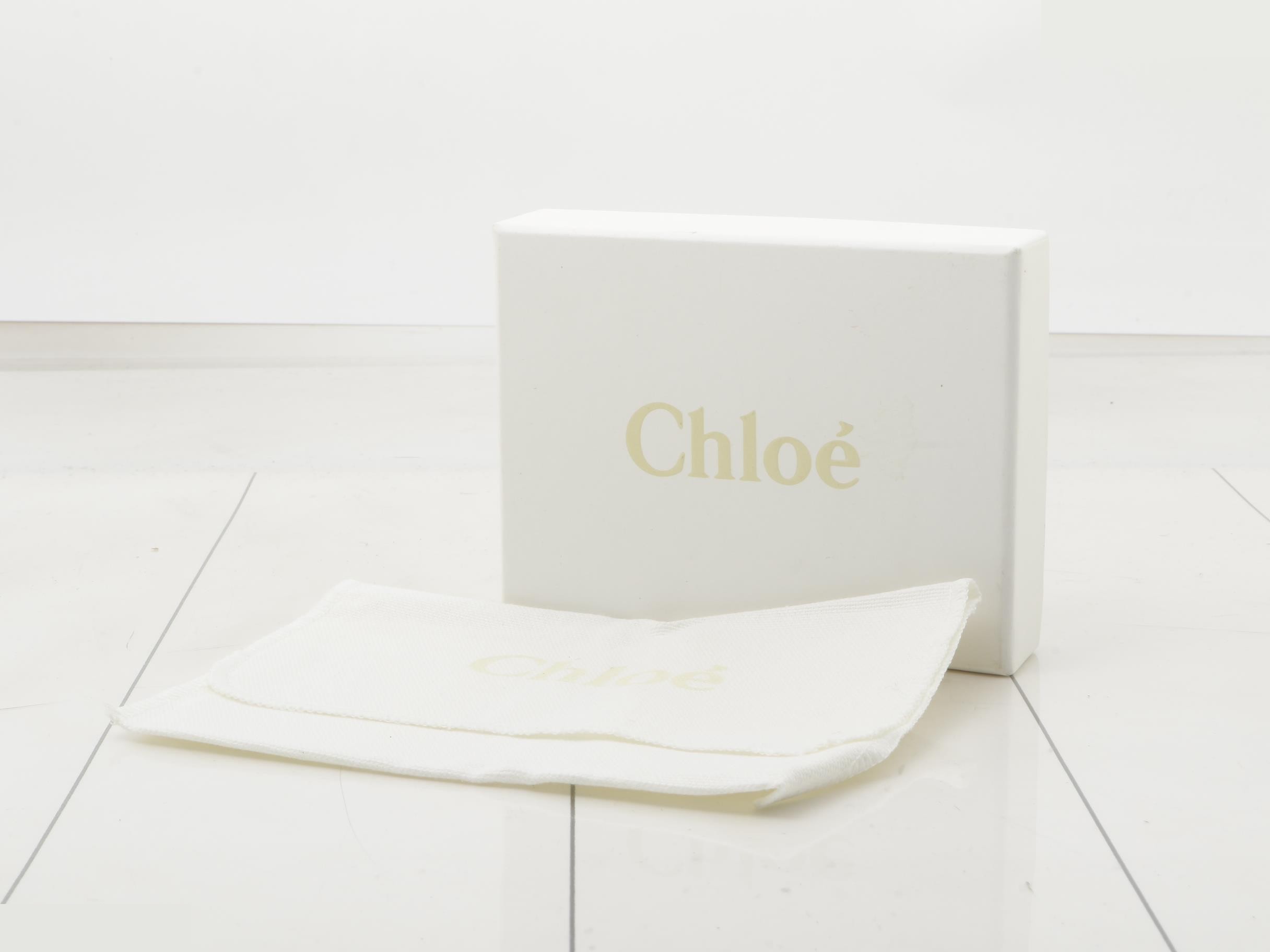Leather card case with gold hardware. — view 5