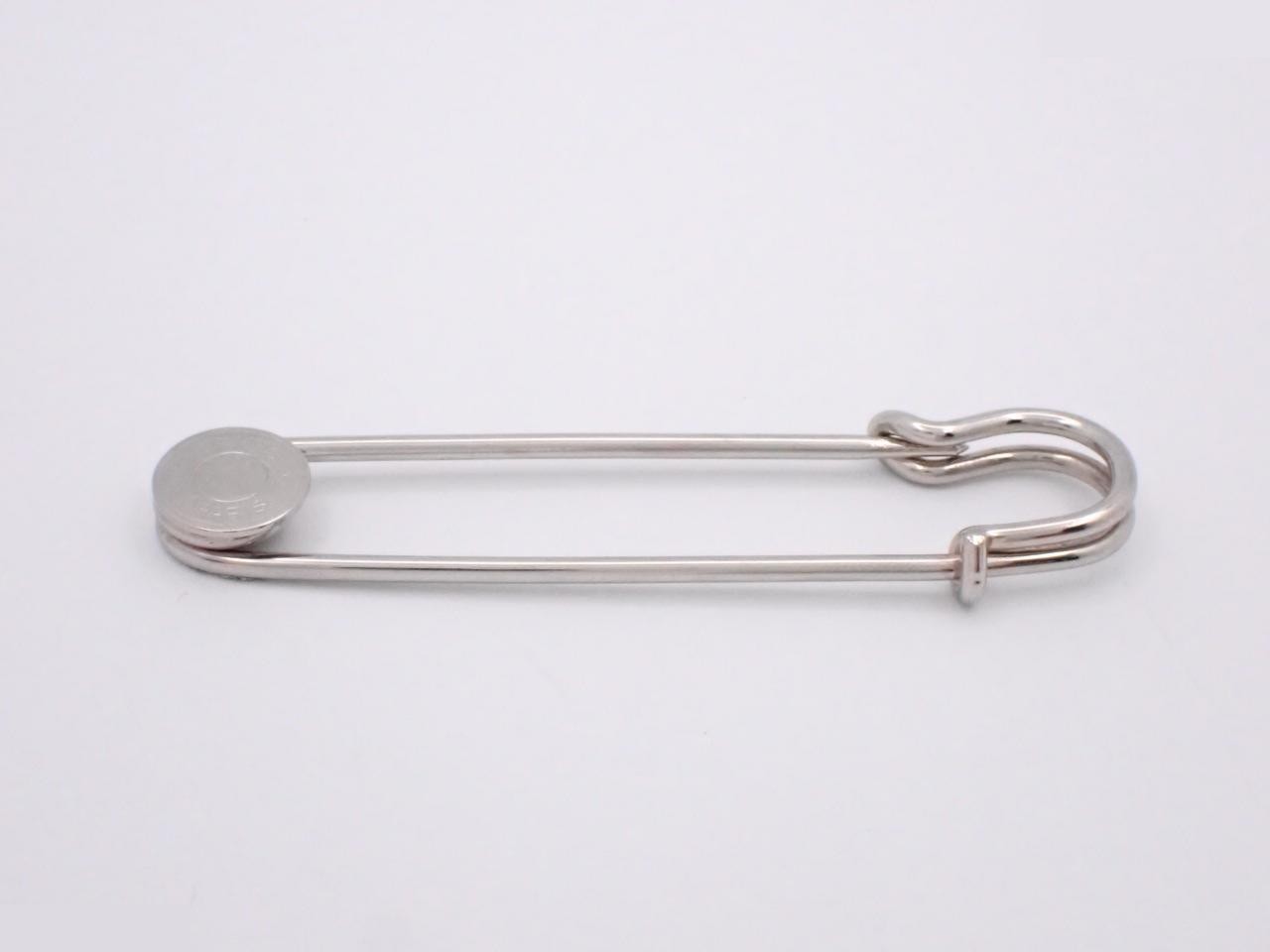 Sellier brooch