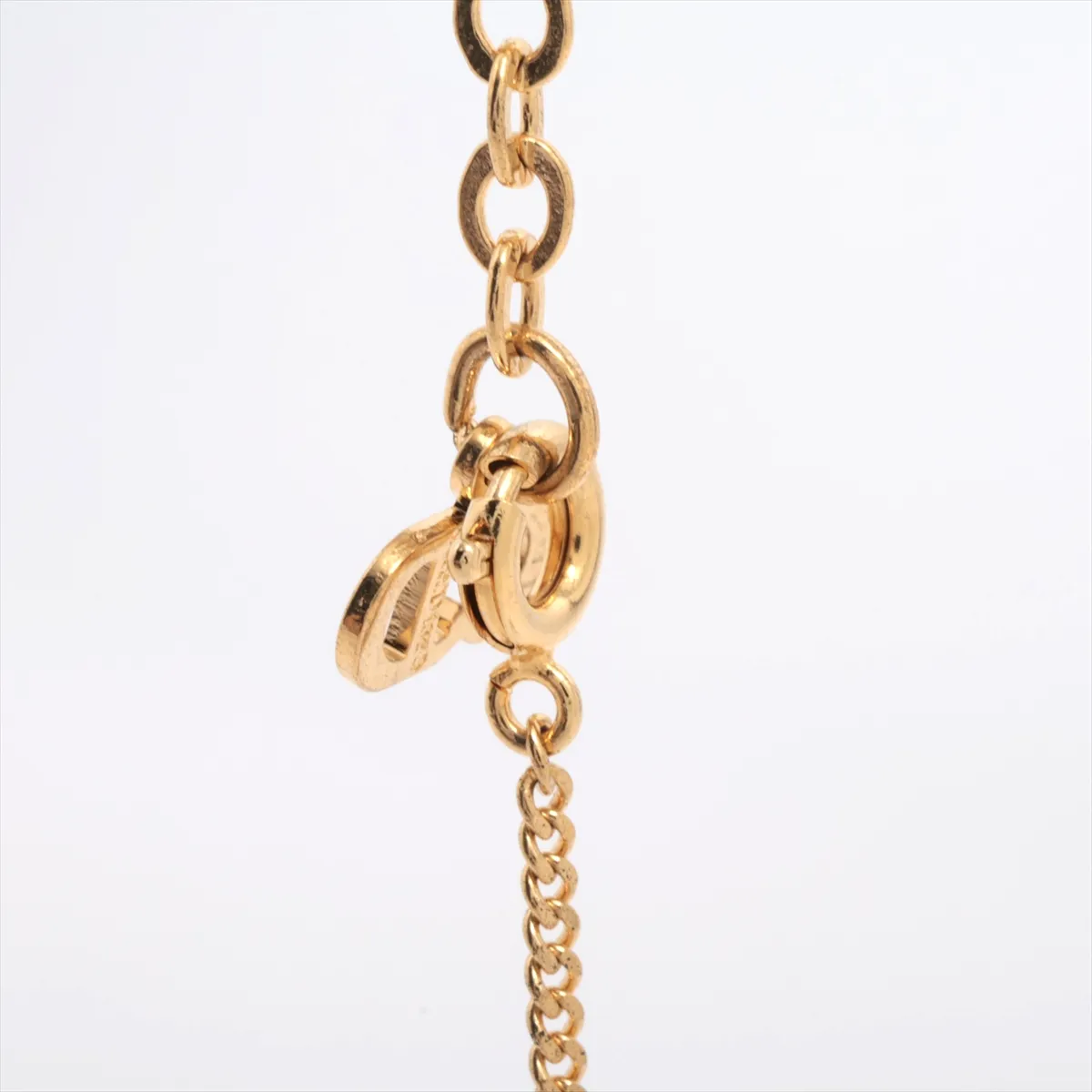 CD logo necklace, gold plated with rhinestones, shows signs of wear, tarnishing, — view 3