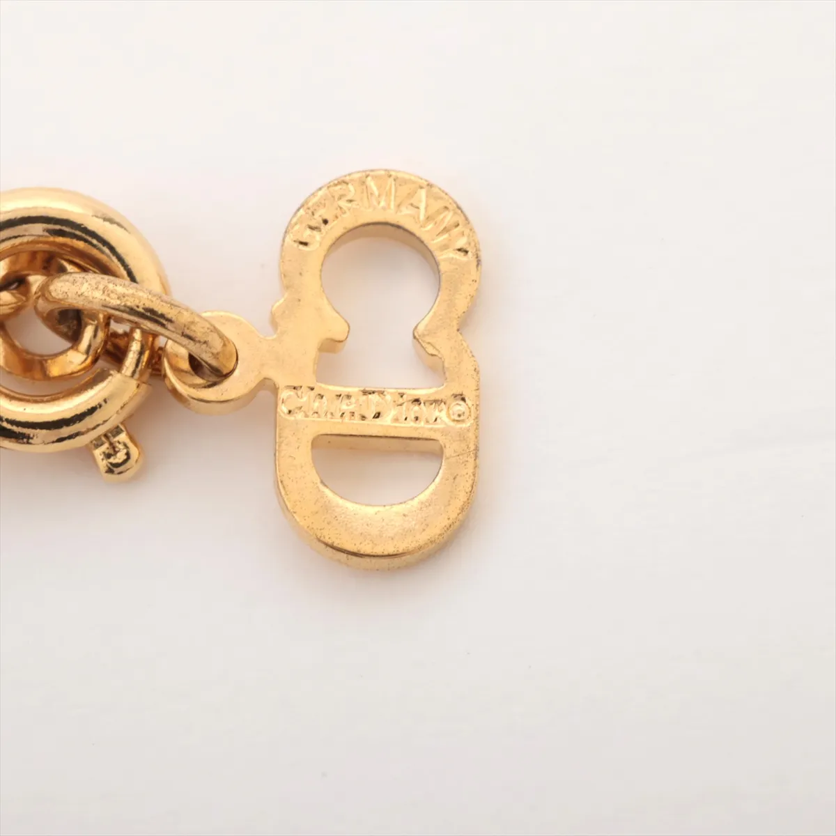 CD logo necklace, gold plated with rhinestones, shows signs of wear, tarnishing, — view 4