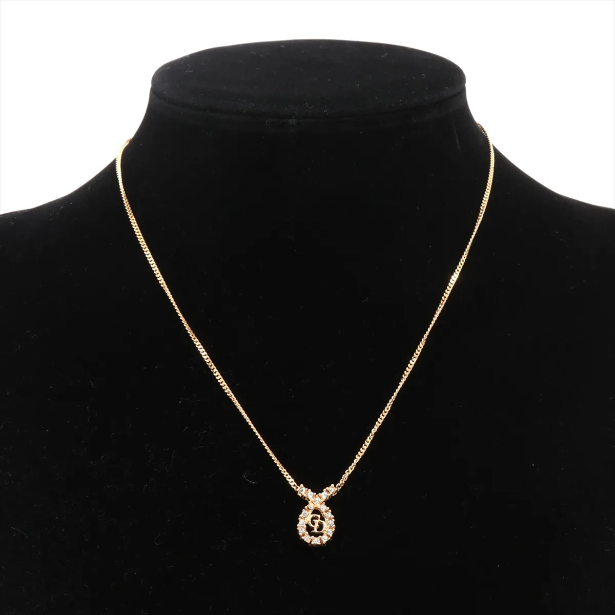CD logo necklace, gold plated with rhinestones, shows signs of wear, tarnishing, — view 5