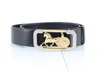 leather belt with carriage hardware.