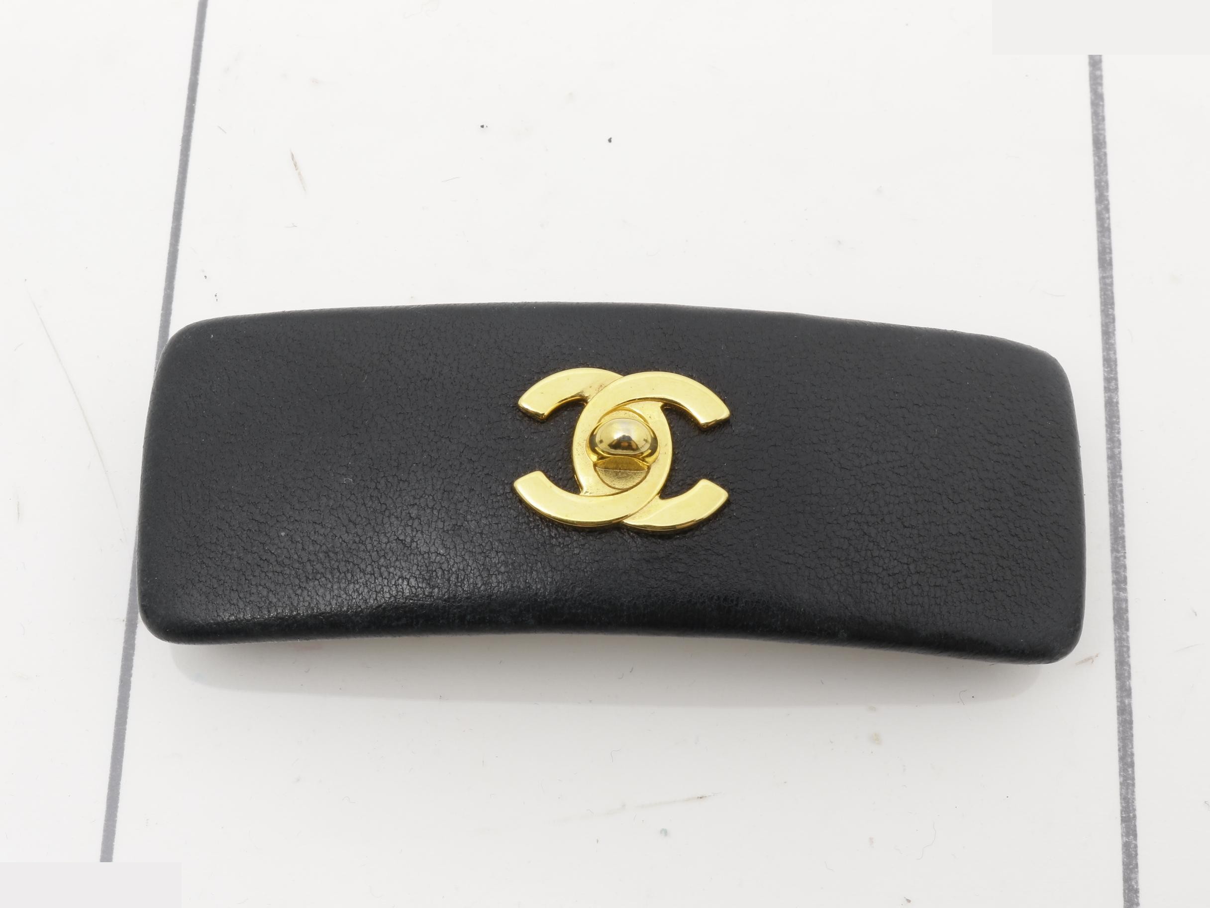 Leather turn-lock barrette with Coco Mark