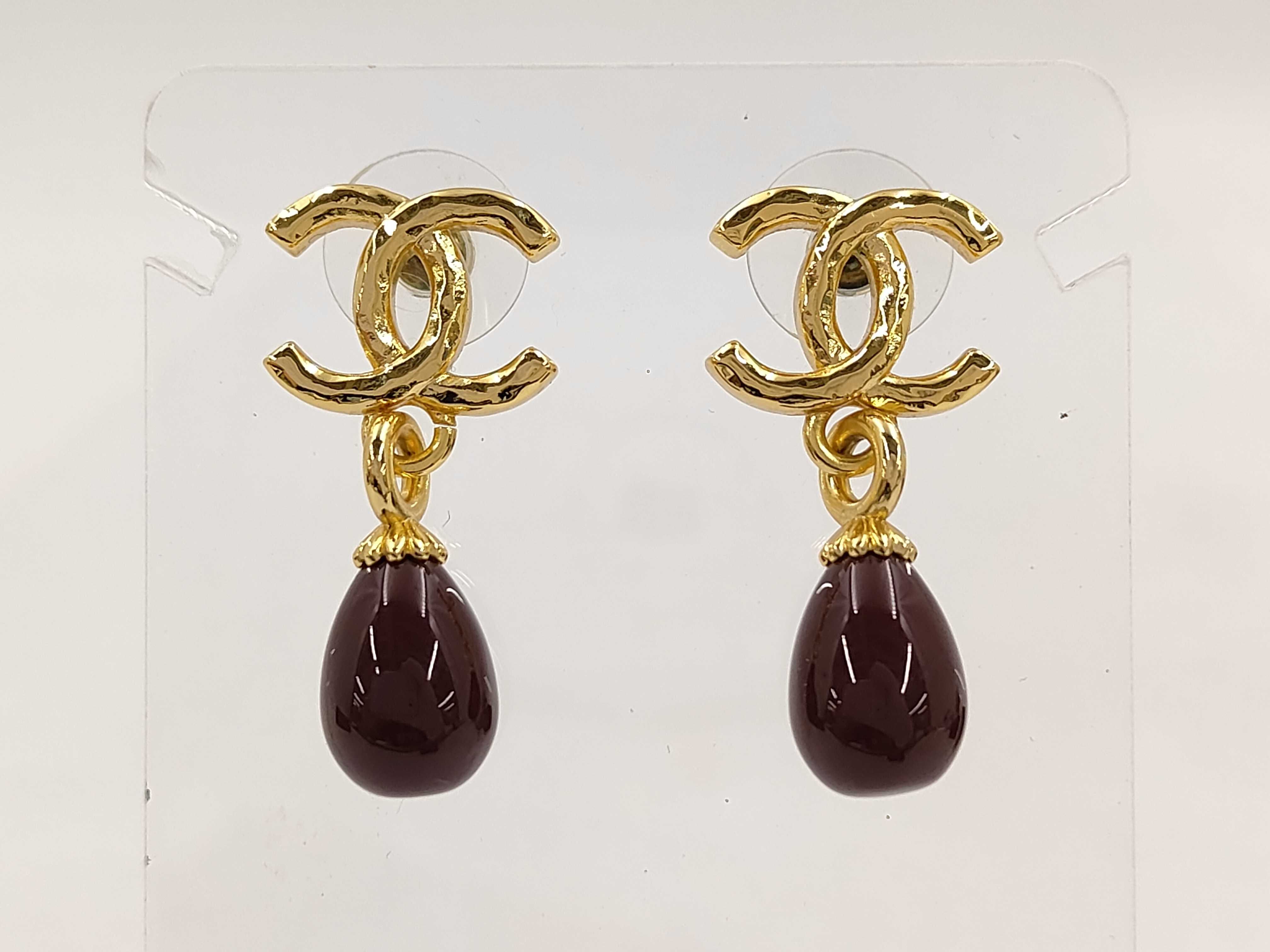 earrings, Coco Mark design, purple and gold.