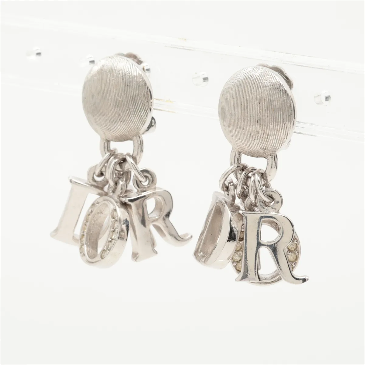 logo earrings (for both ears), metal and rhinestone, silver. Shows signs of wear, — view 3
