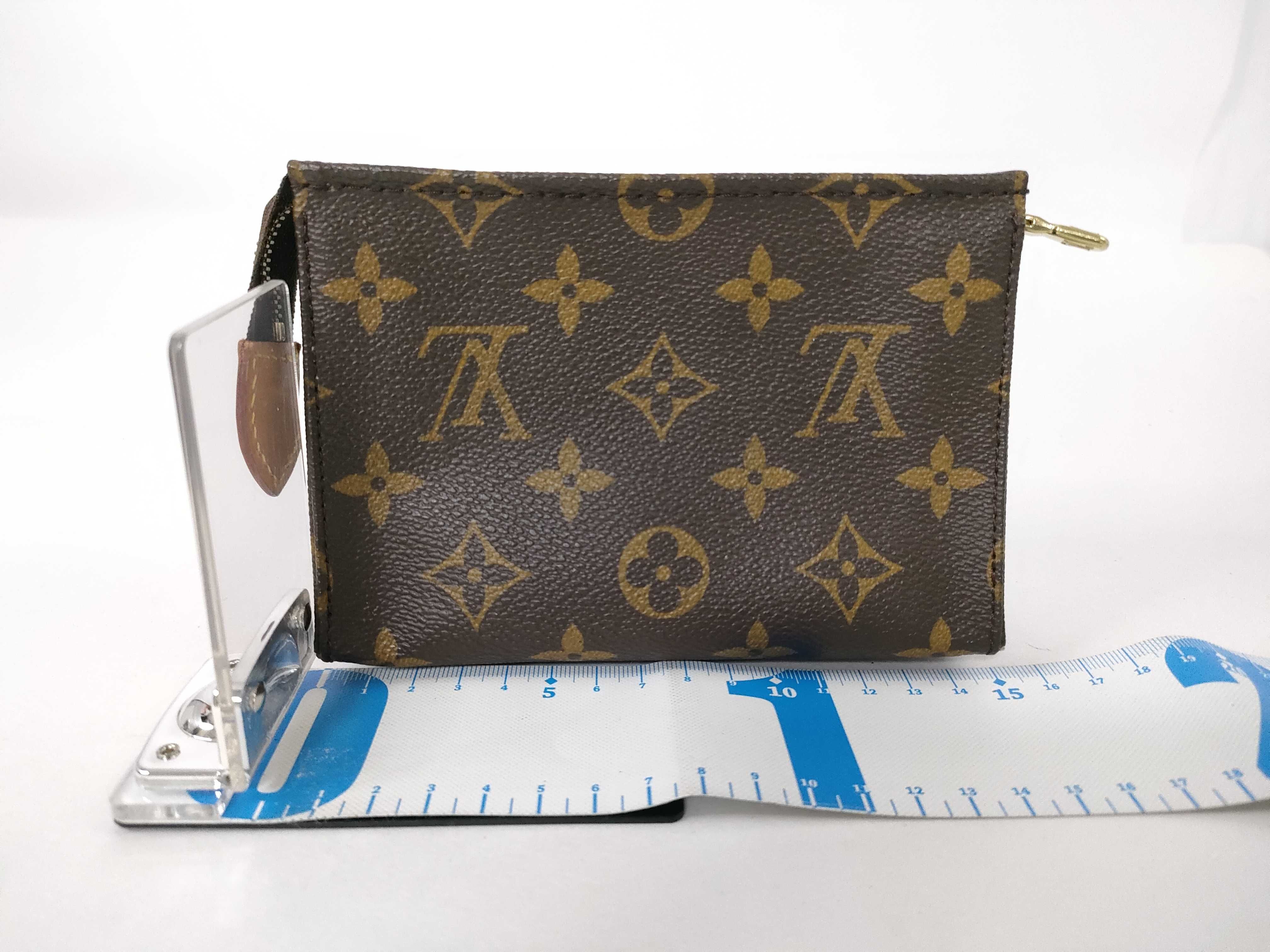 Monogram Pouch, Model Number M47542, Serial Number Unknown, Slight Discoloration/Corner Scuffs. — view 2