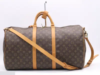 Keepall Bandouliere 55: Shoulder strap, padlock, 2 keys, name tag.