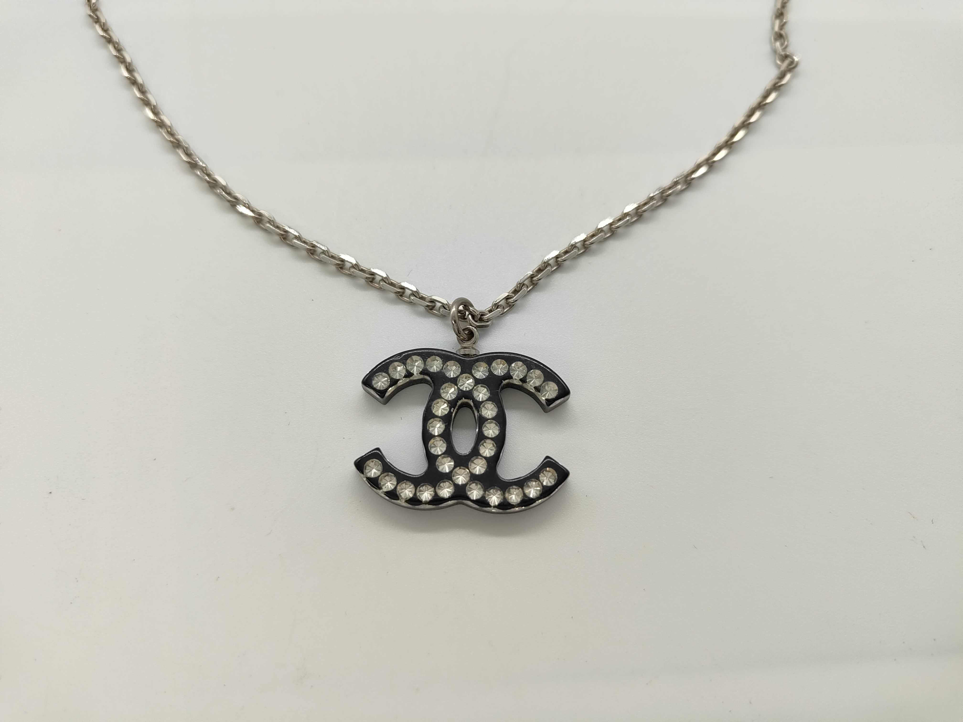 necklace with box, acrylic, silver and black.