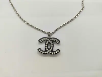 necklace with box, acrylic, silver and black.