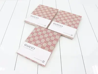 Unused Gucci novelty notebooks, set of 3.