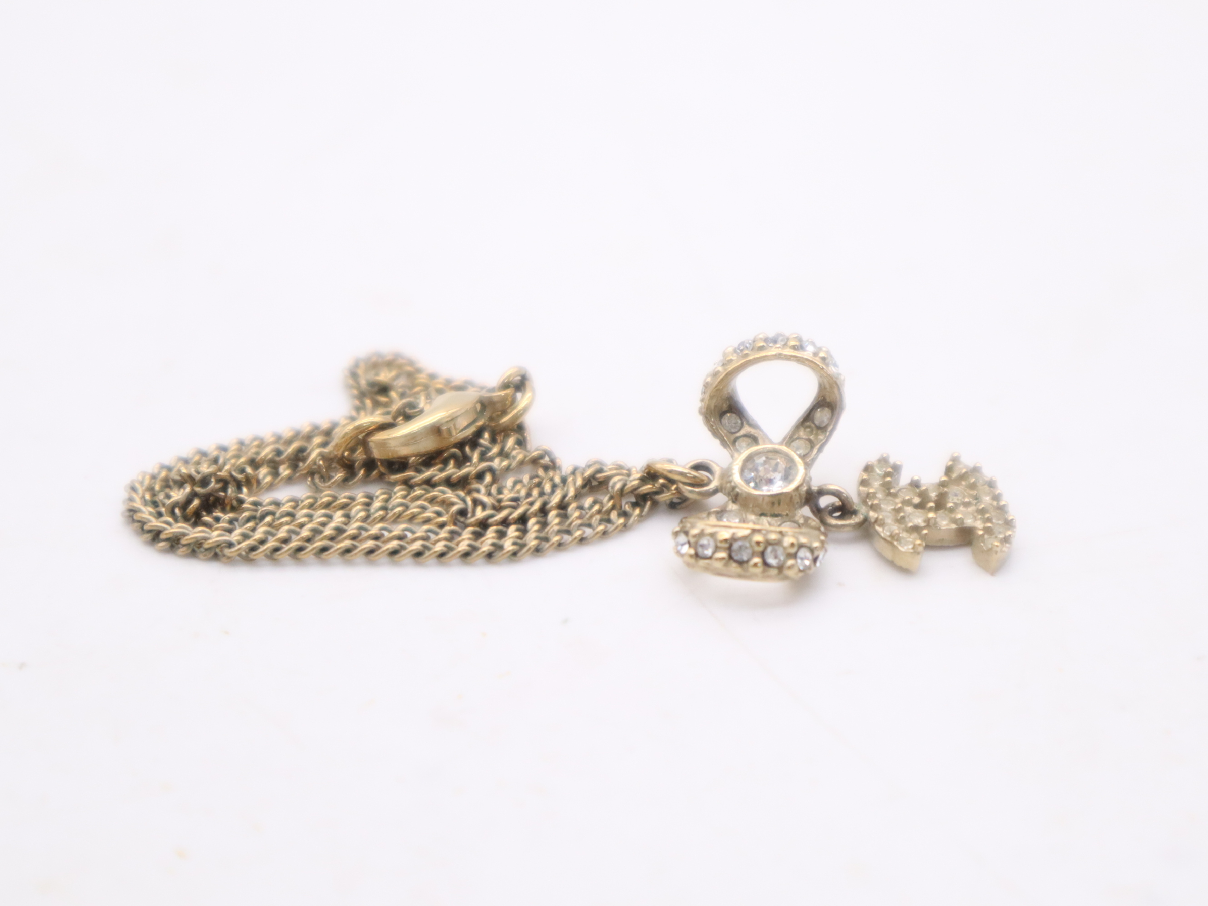 Gold Ribbon Coco Mark Necklace — view 3
