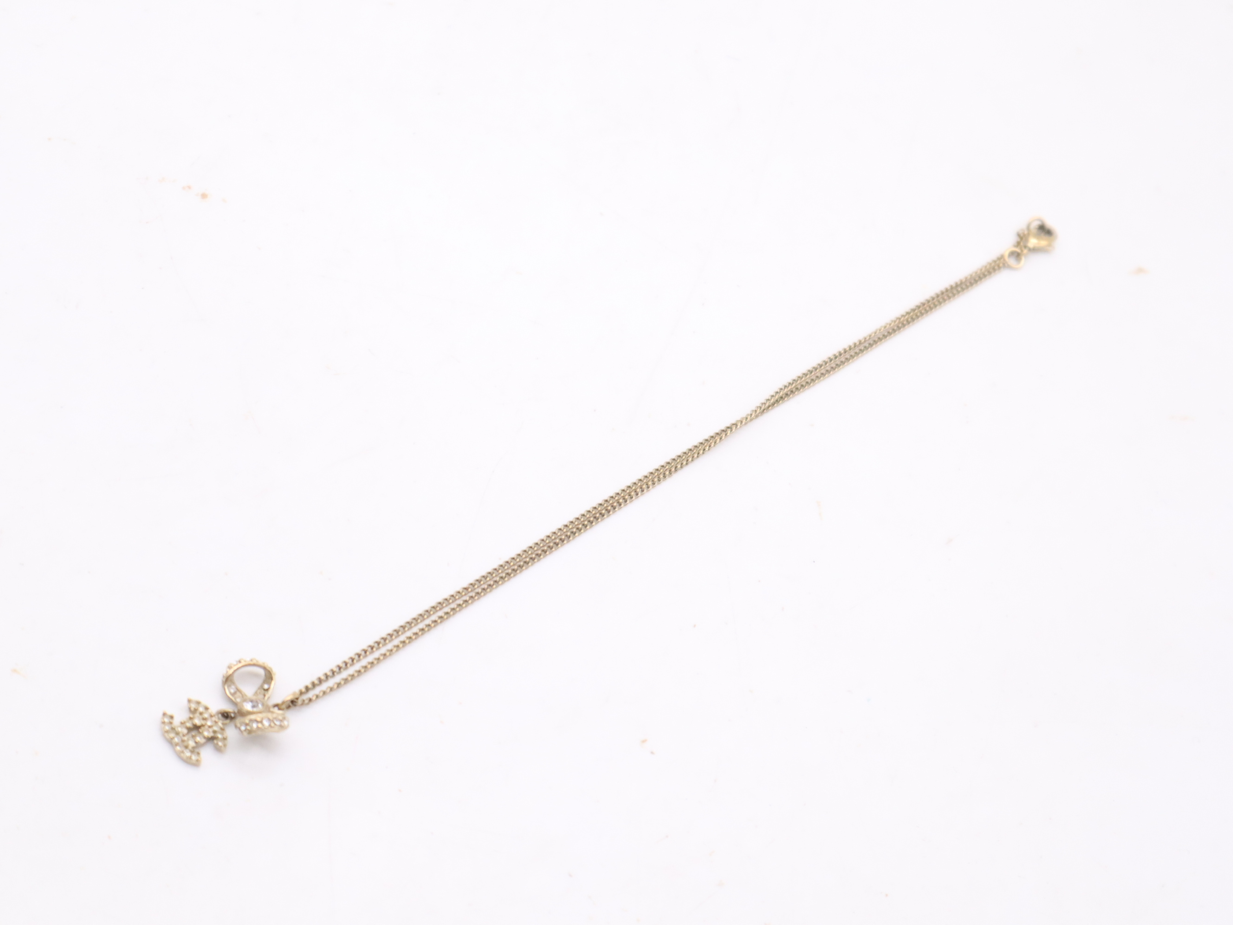 Gold Ribbon Coco Mark Necklace — view 6