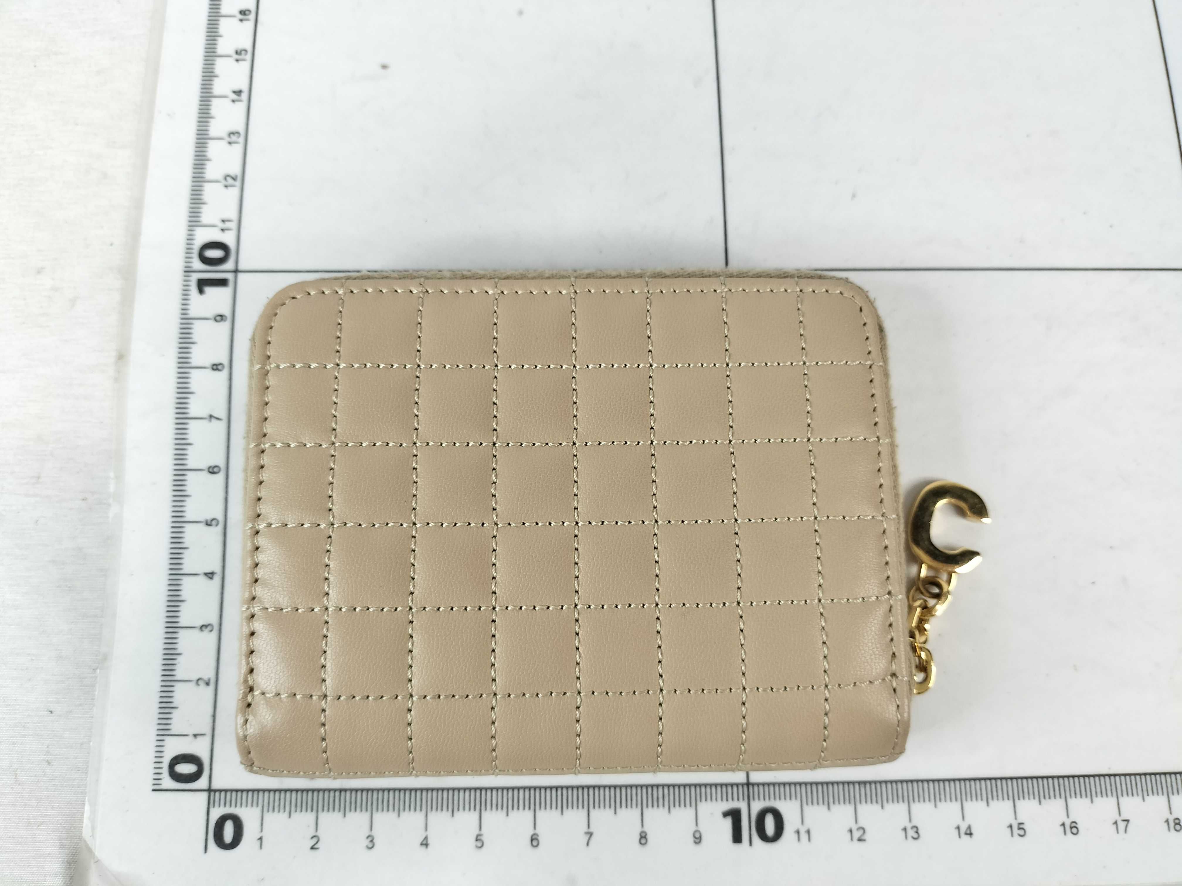 quilted coin case in beige with C charm. — view 2
