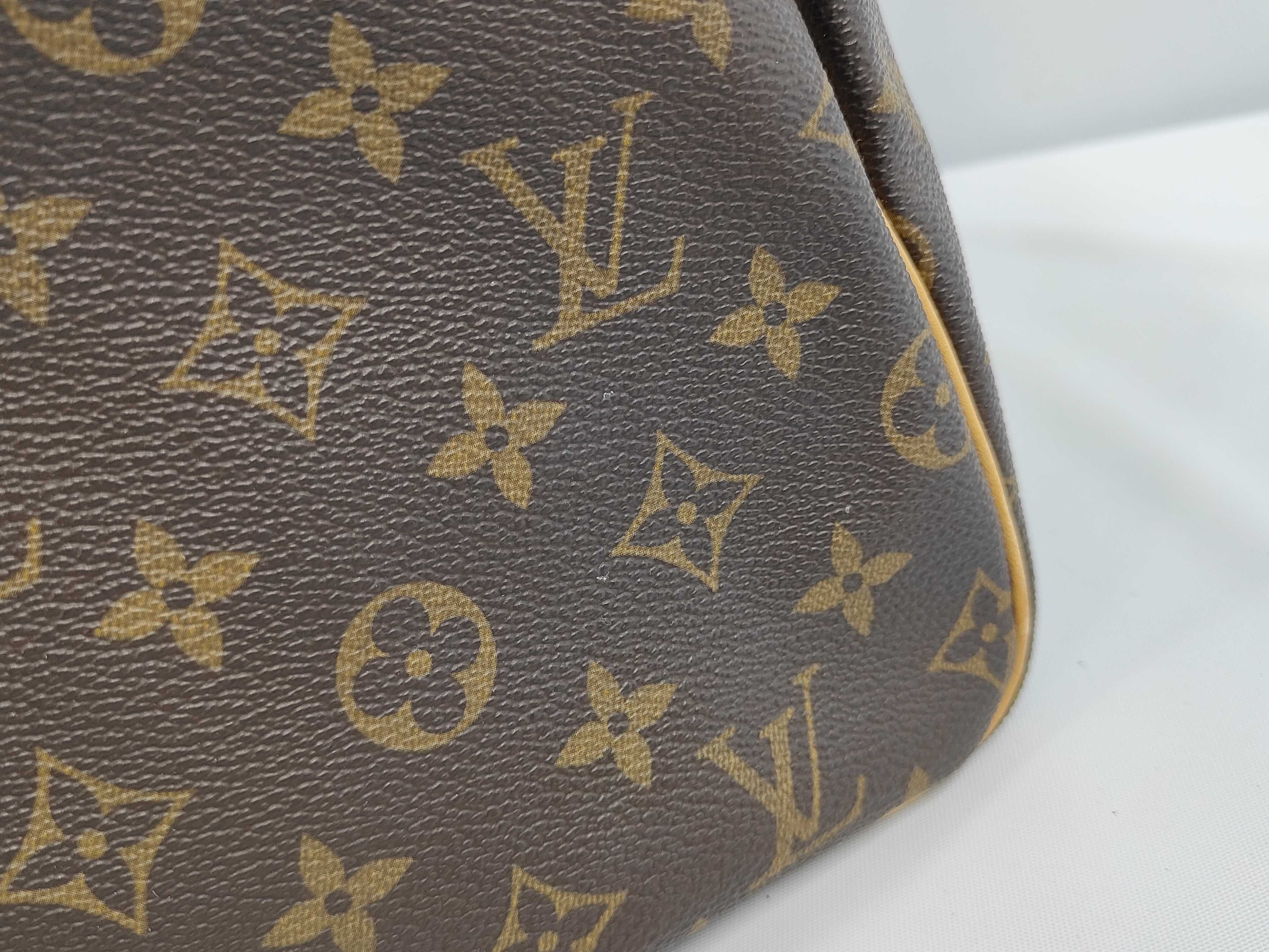 A. Louis Vuitton Speedy Handbag — view 11