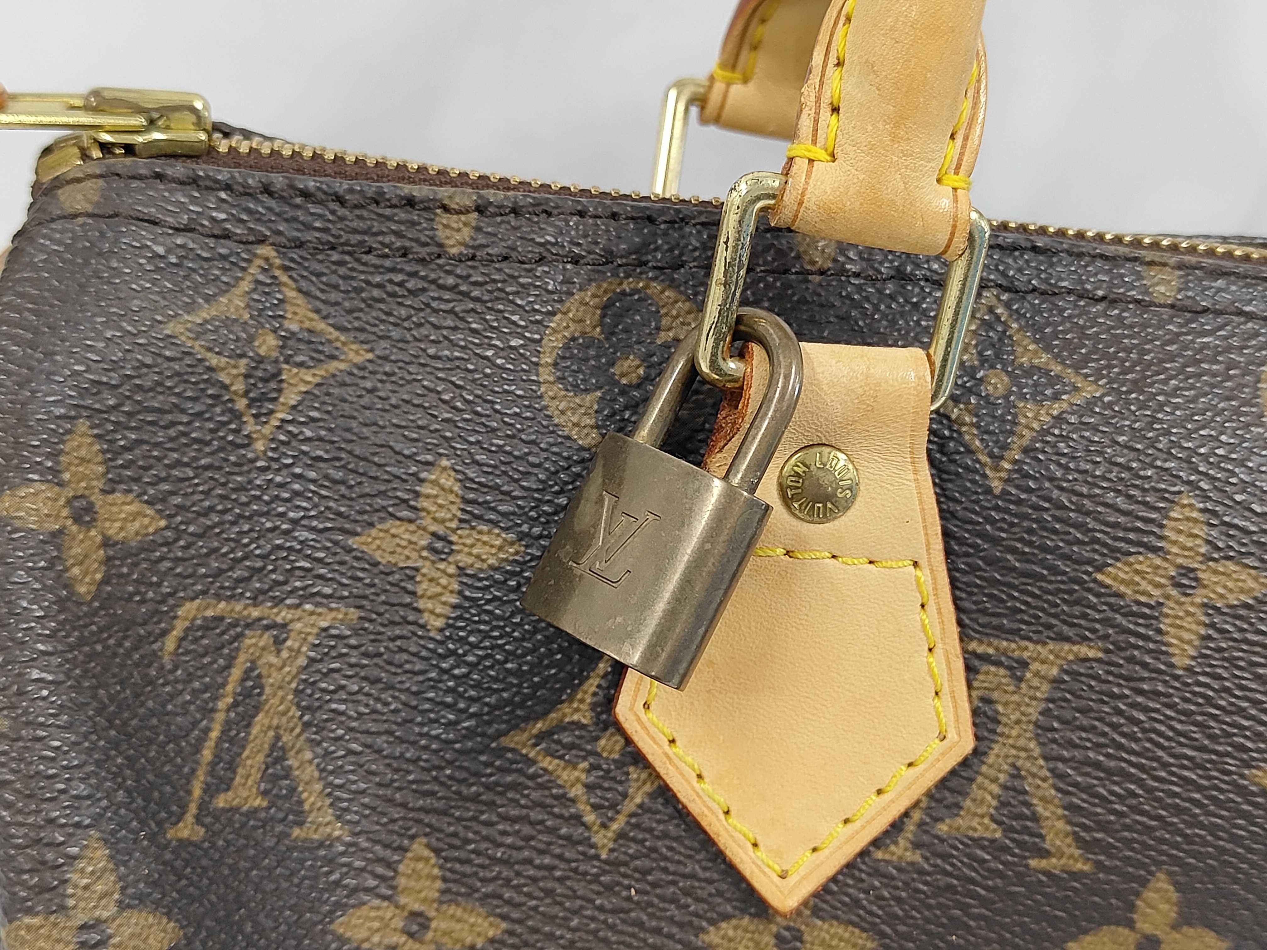 A. Louis Vuitton Speedy Handbag — view 3
