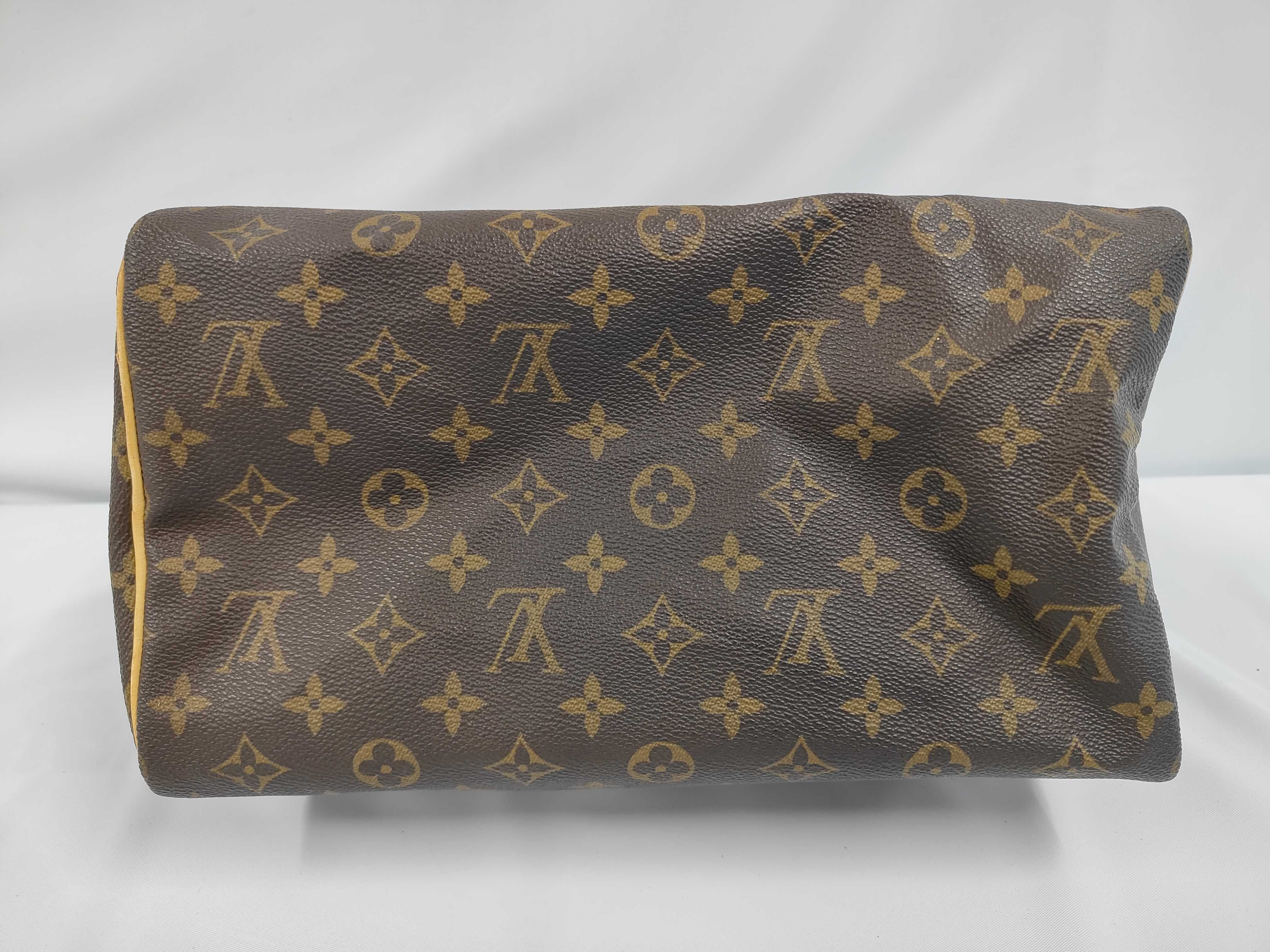 A. Louis Vuitton Speedy Handbag — view 4