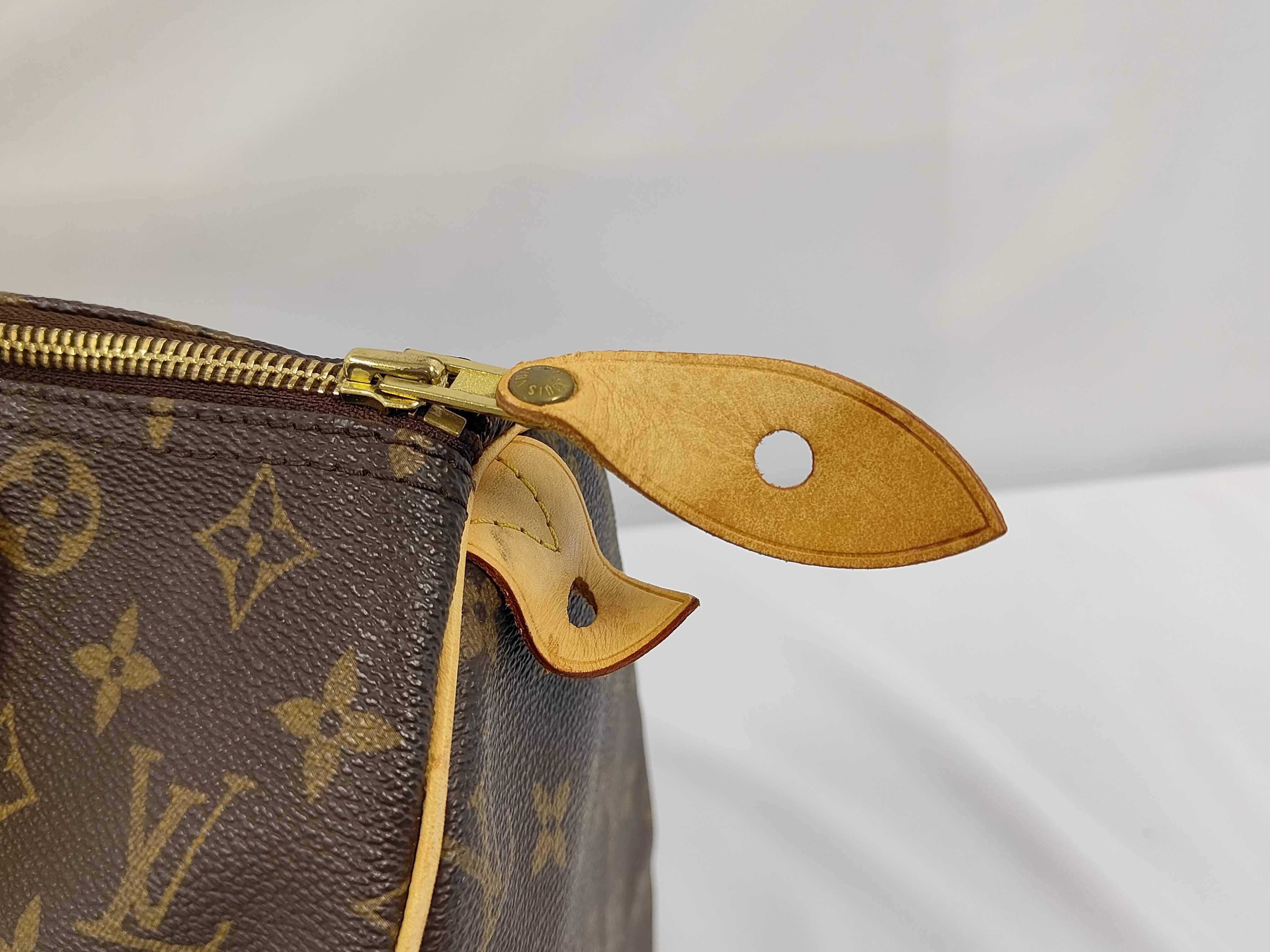 A. Louis Vuitton Speedy Handbag — view 8