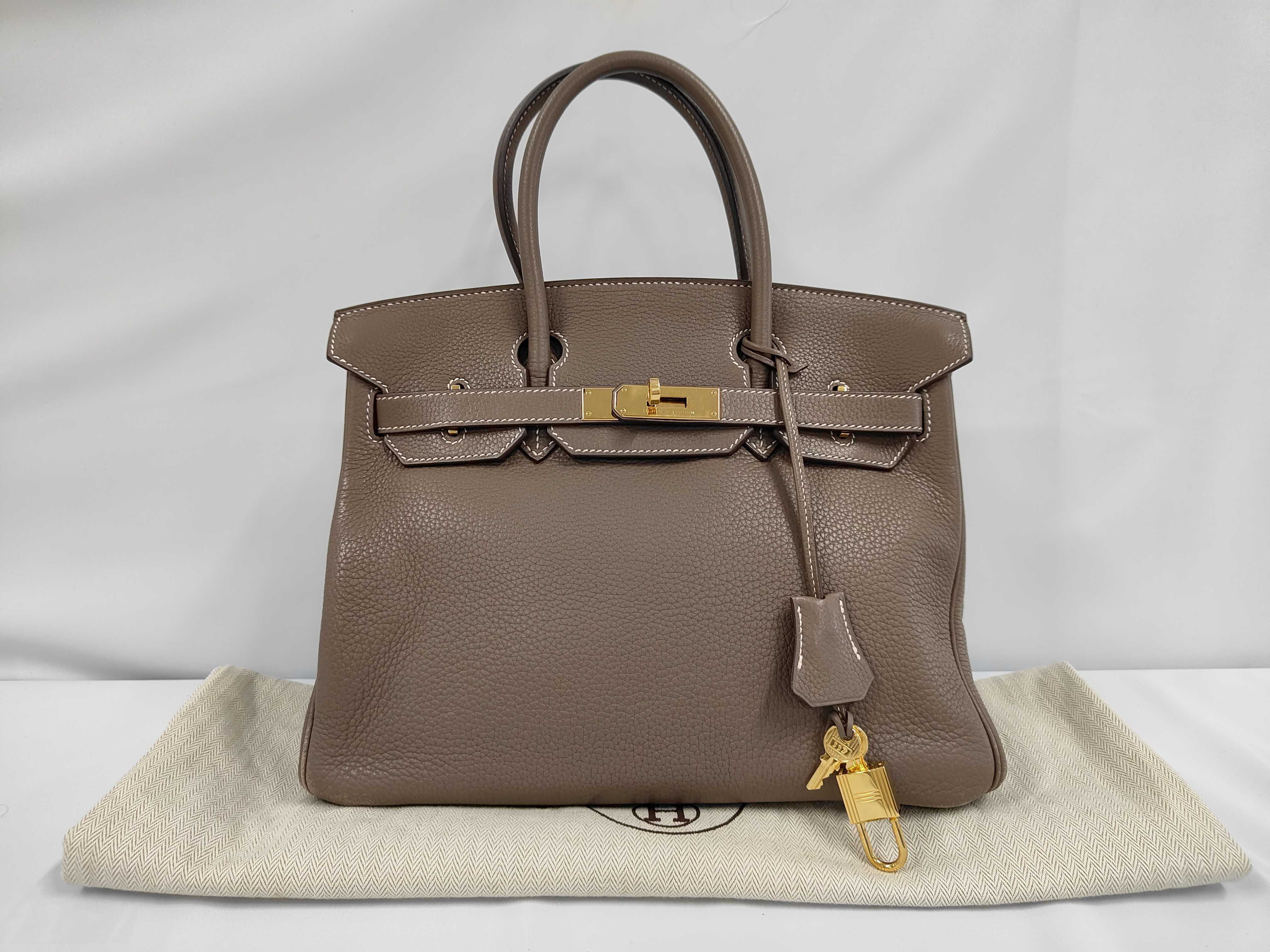 Birkin 30 Handbag, L stamp, Taurillon leather, Gold hardware, Etoupe color, Includes clochette, padlock, 2 keys, and dust bag.
