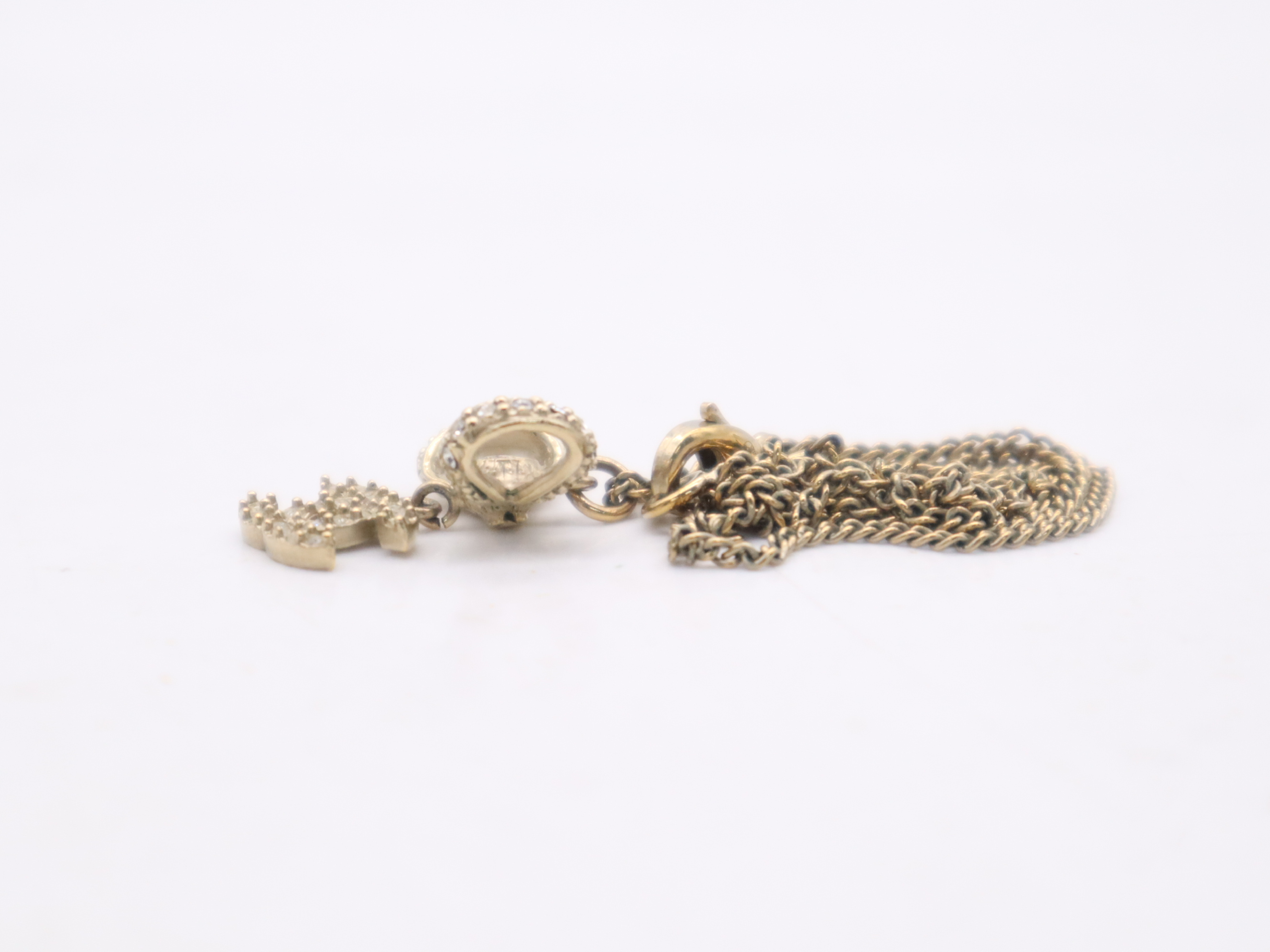 Gold Ribbon Coco Mark Necklace — view 5