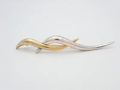 Gold and silver brooches