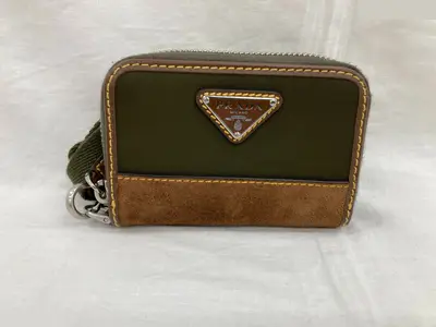 Wallet, coin case, and shoulder strap included.