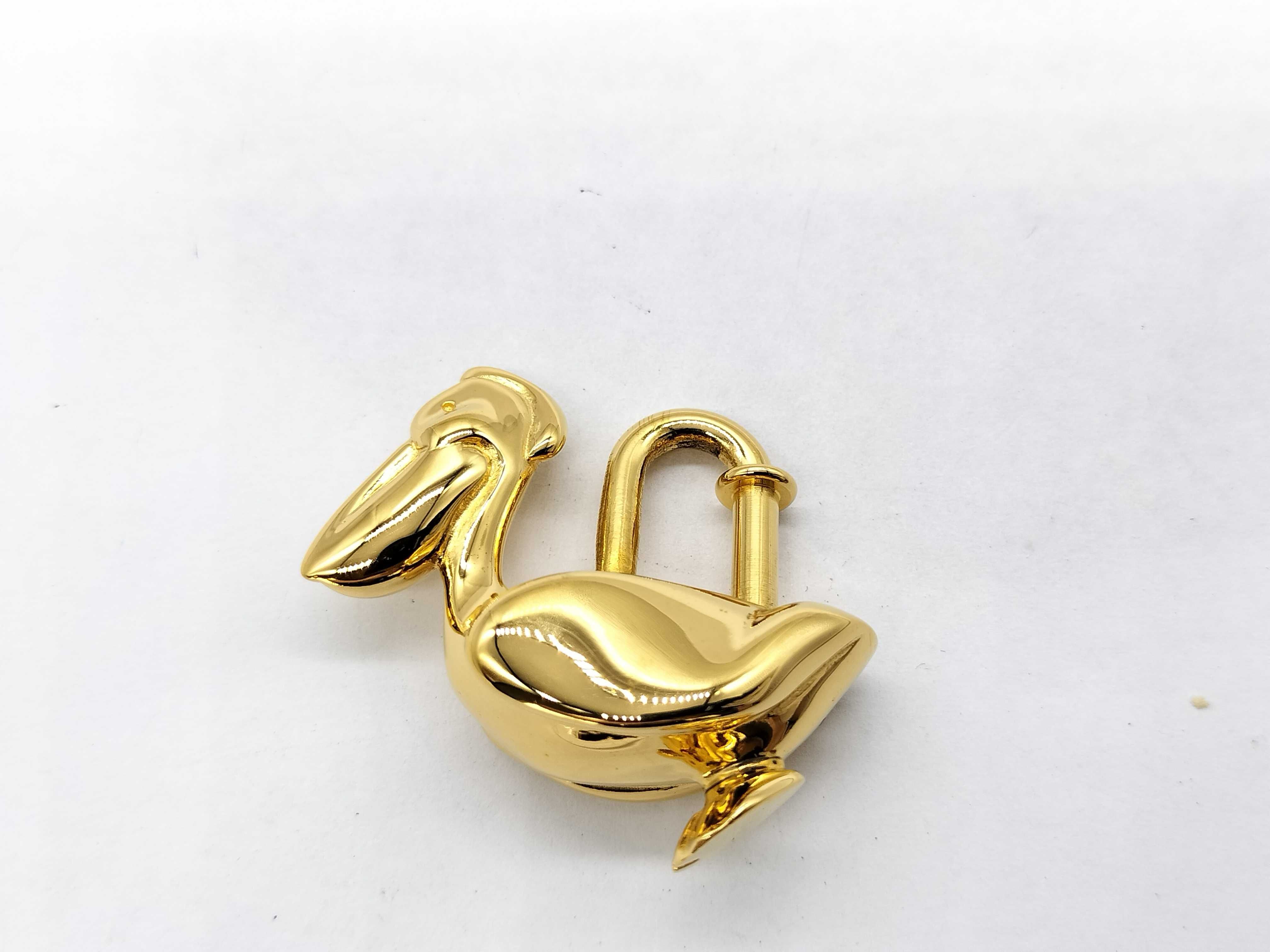 padlock, Pelican design, gold, and other accessories.