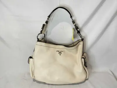 One-Shoulder White / Corner deterioration / Shape distortion considered. Black interior handbag.