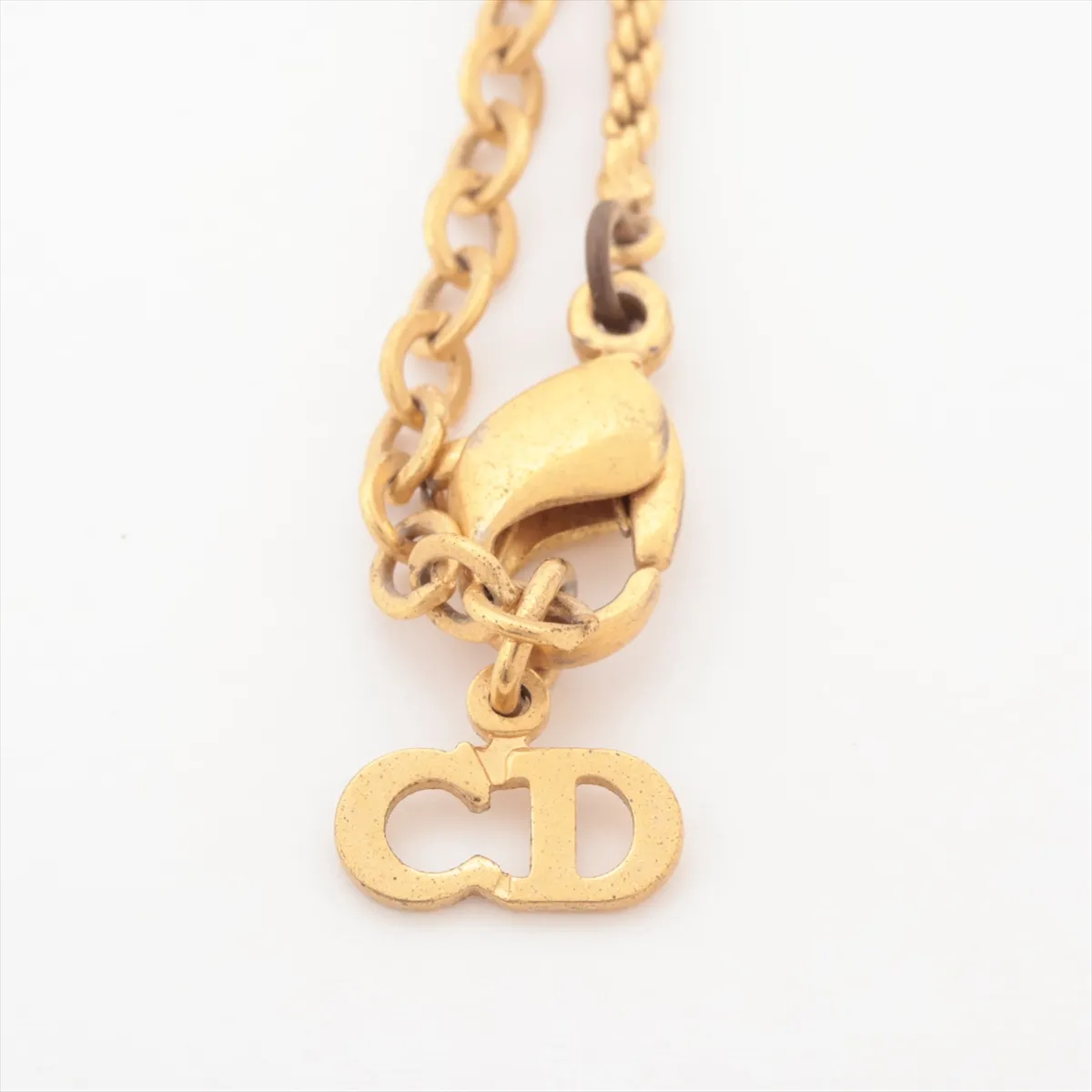 CD logo necklace, gold plated with rhinestones. Shows signs of wear, — view 4