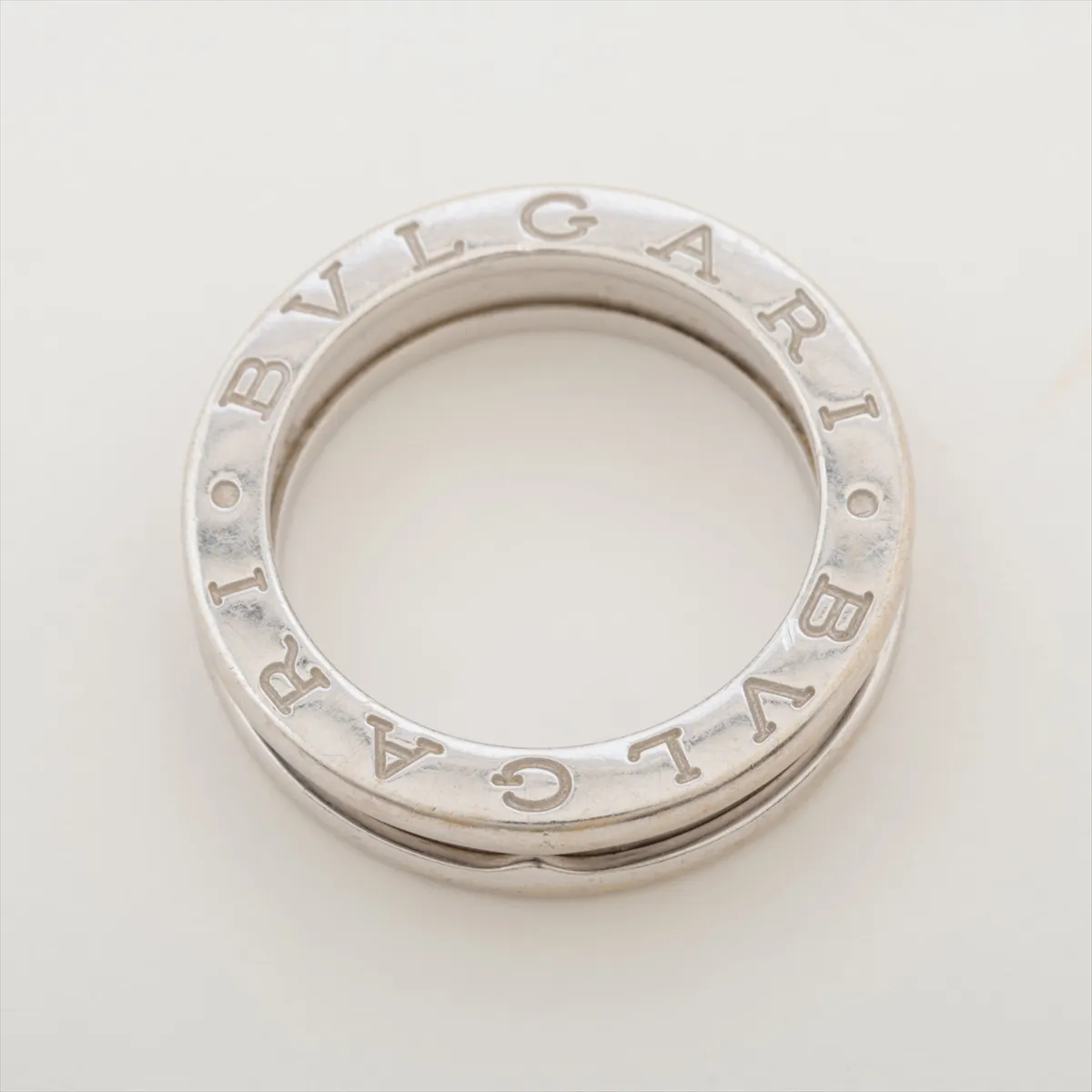 B.zero1 ring, 750 (WG), 5.8g, size 48. Shows signs of wear, dents, and some plating peeling. — view 3