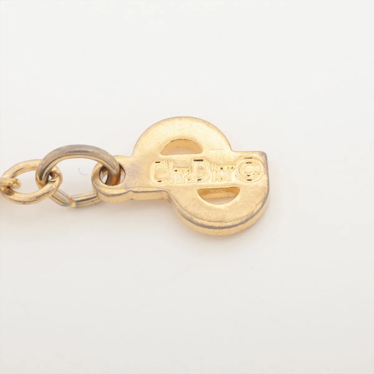 CD logo necklace, gold plated with rhinestones. Shows signs of wear, — view 4