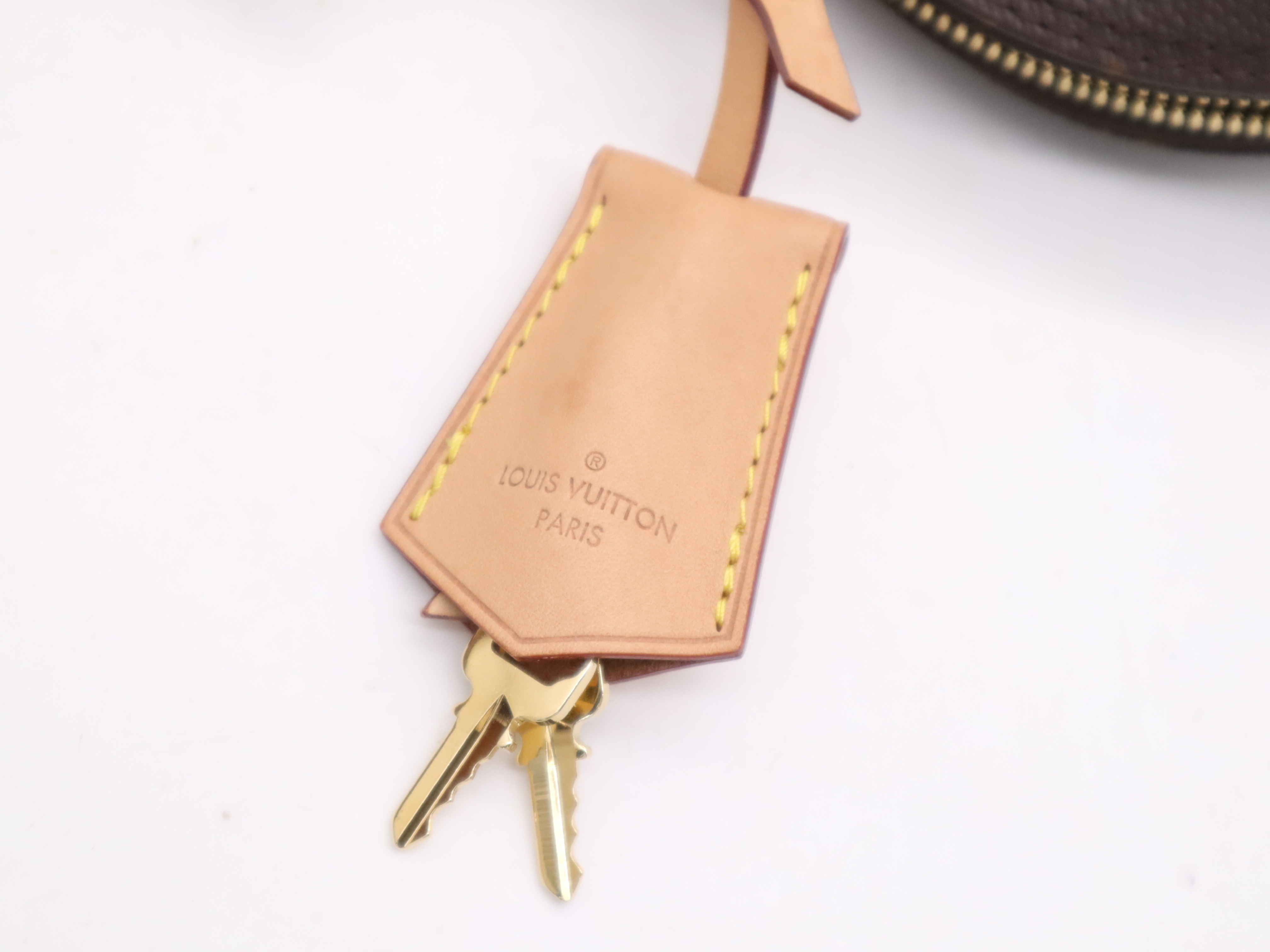 M53152 Monogram Alma BB Handbag with Shoulder Strap, Padlock, 2 Keys, Clochette, and Dust Bag — view 14