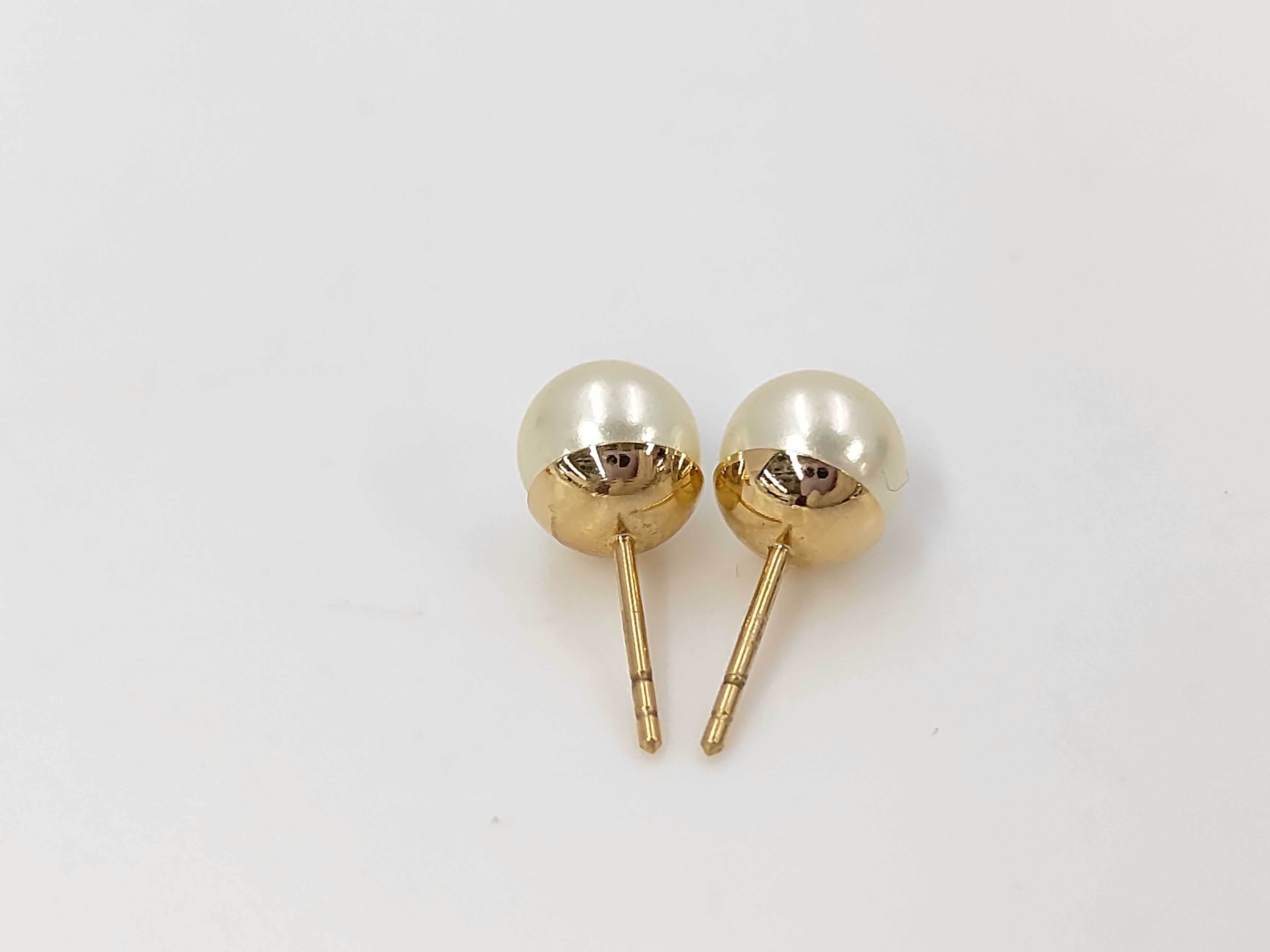 pearl logo earrings in box — view 2