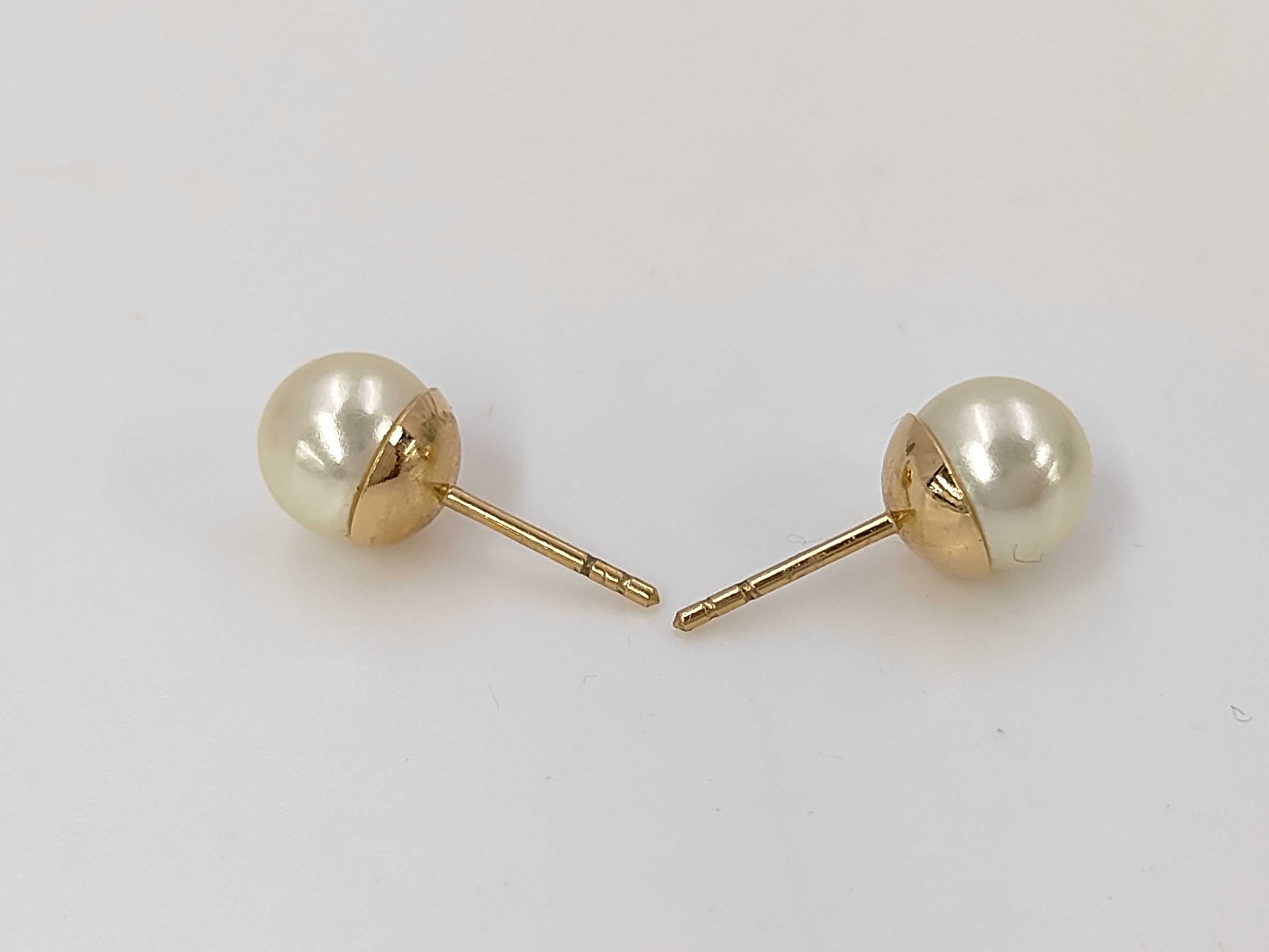 pearl logo earrings in box — view 3
