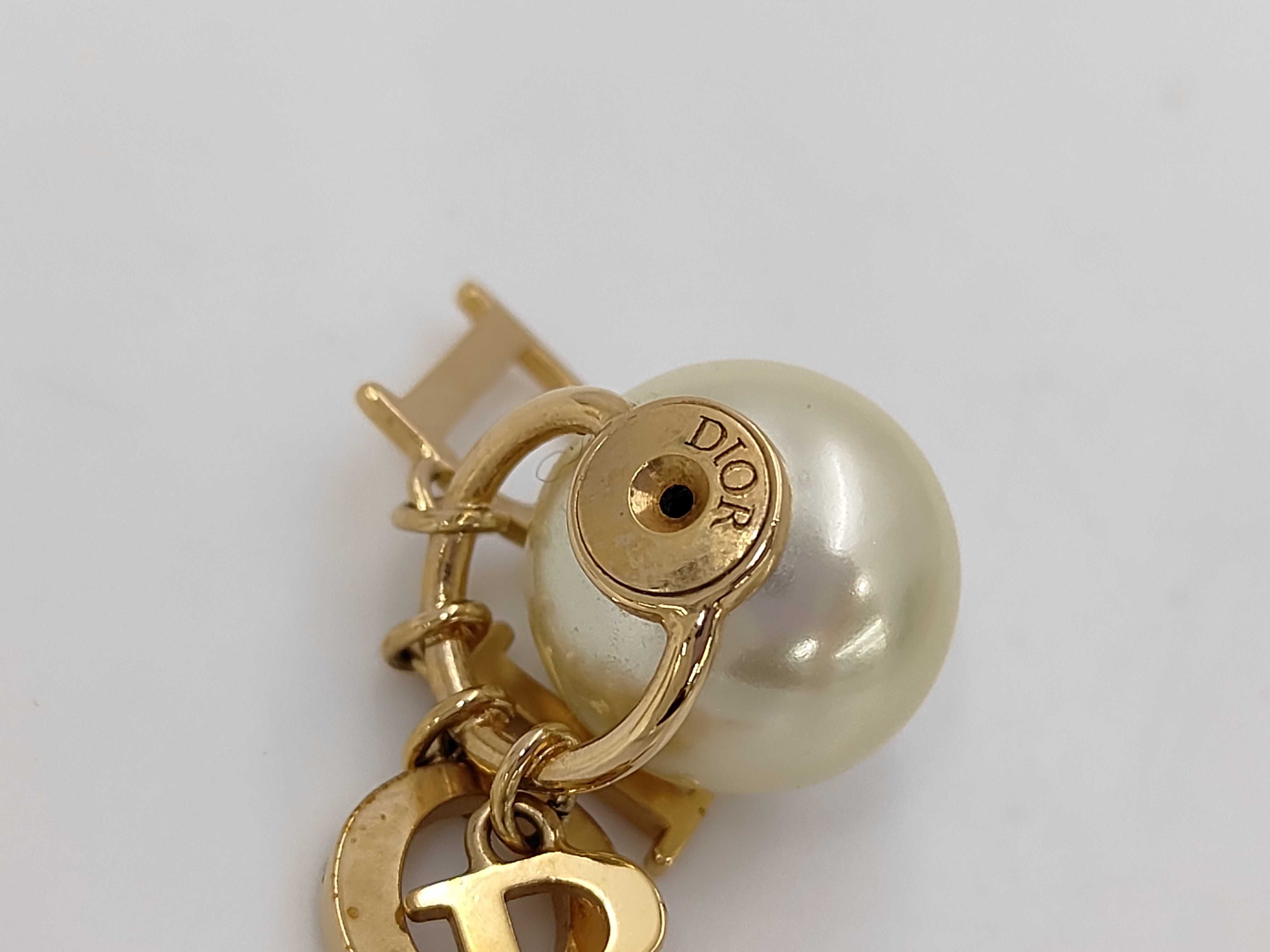 pearl logo earrings in box — view 6