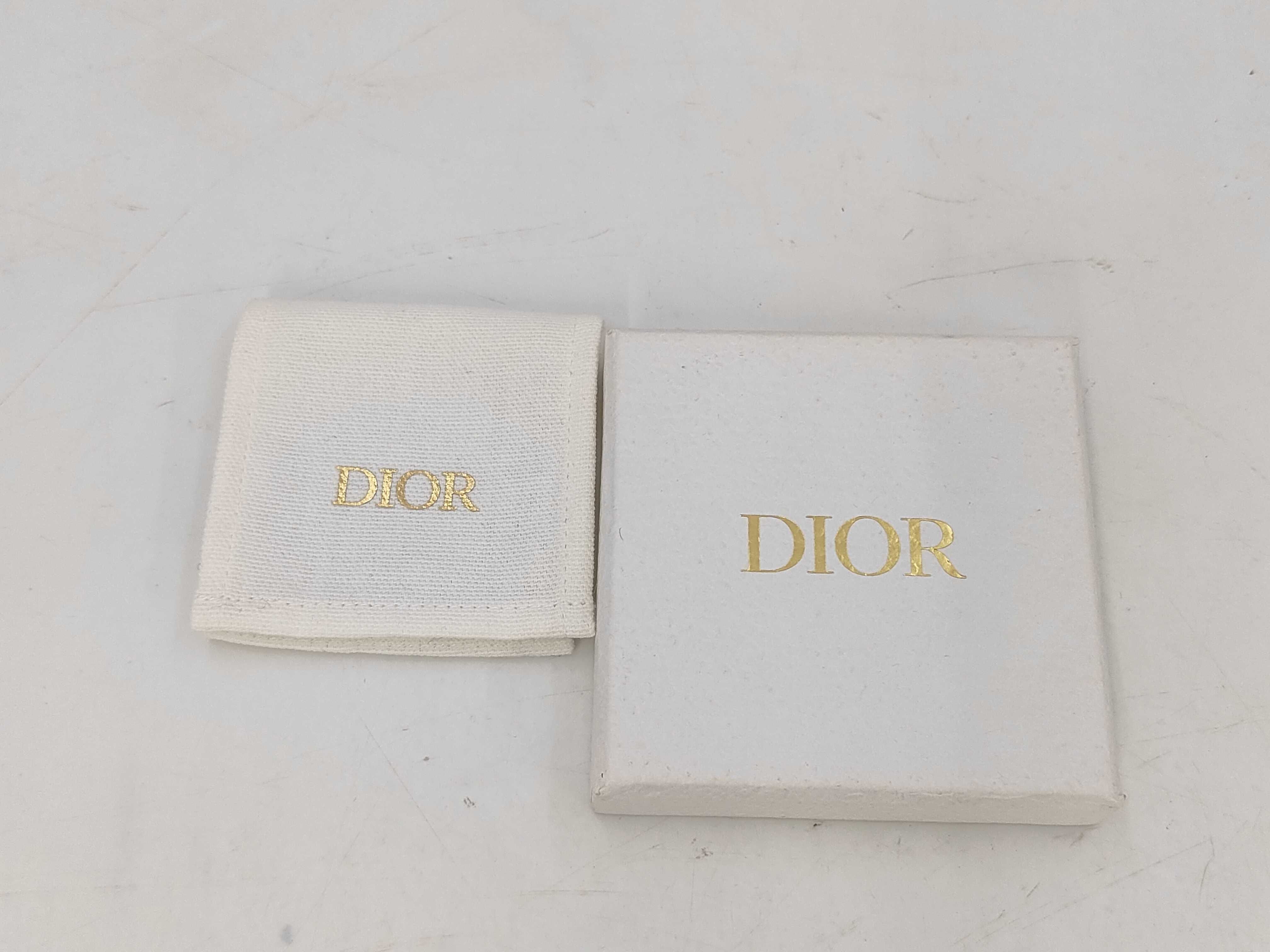 pearl logo earrings in box — view 8