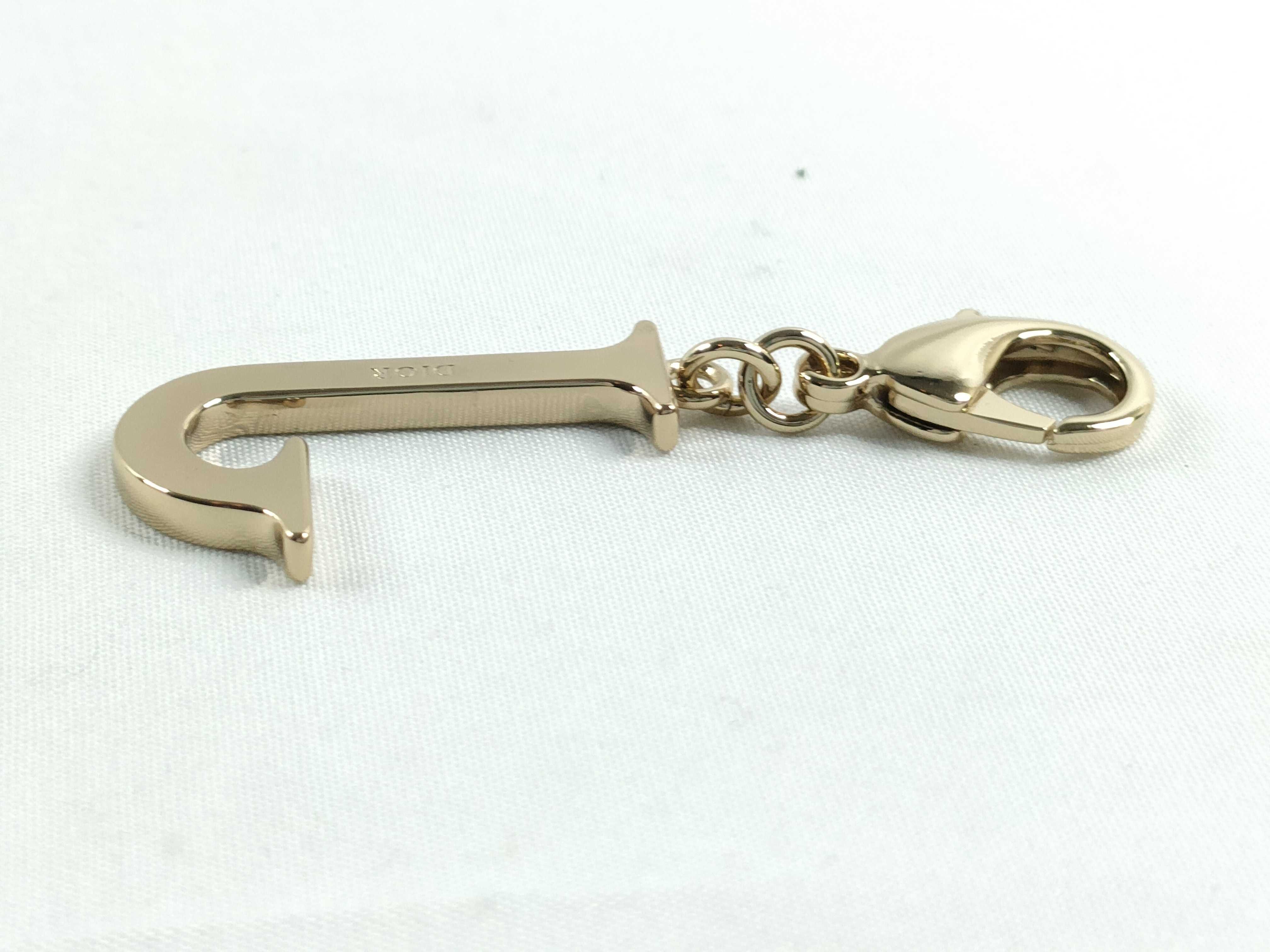 Roman alphabet charm, "J," with tag. — view 5