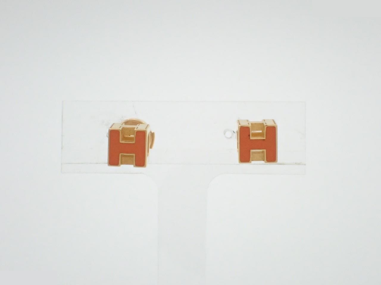 Cage d'H earrings, one earring without backing.