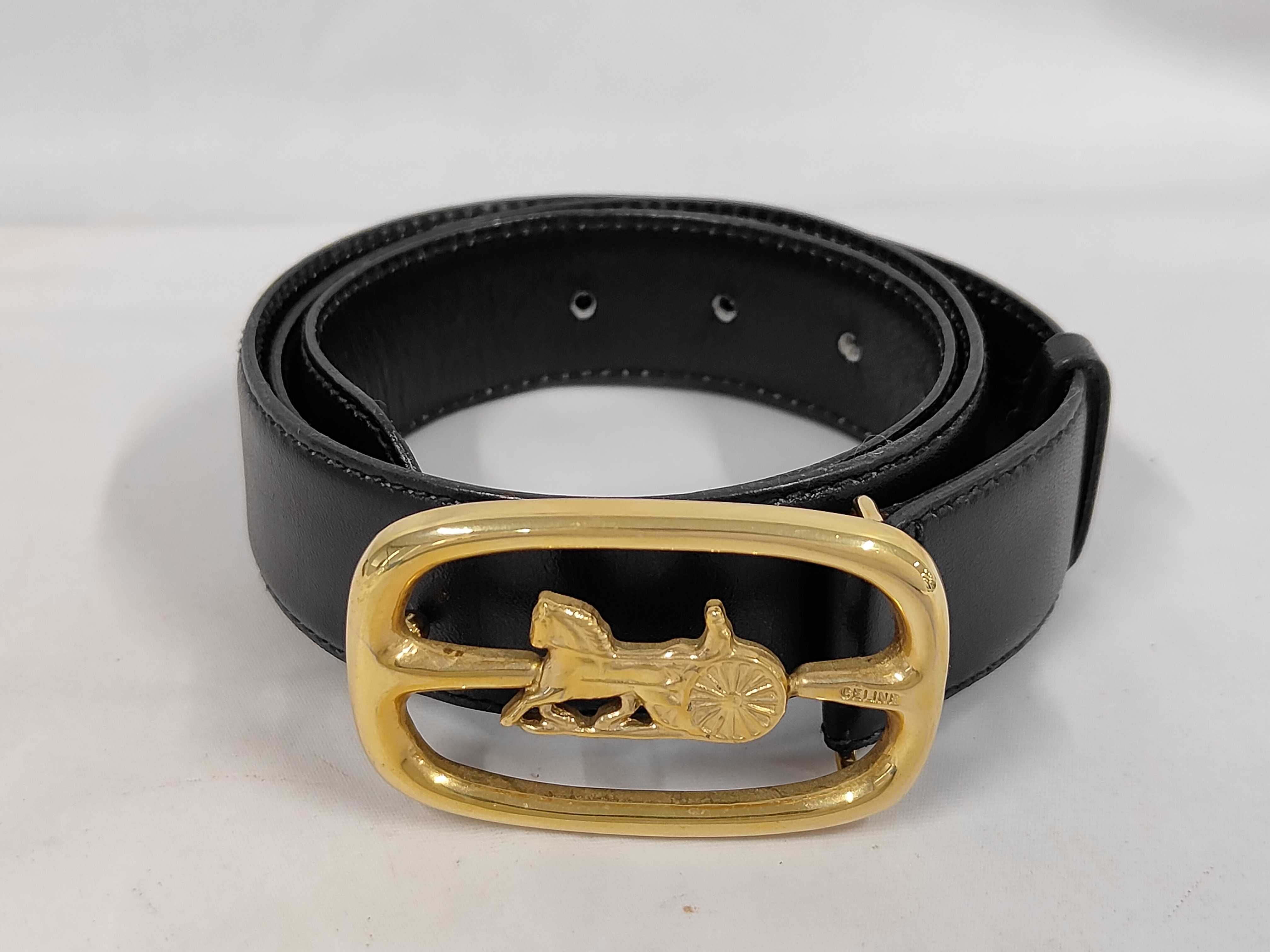 leather belt with carriage-style buckle.