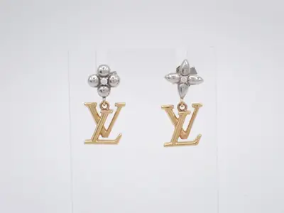Iconic flower earrings, gold.