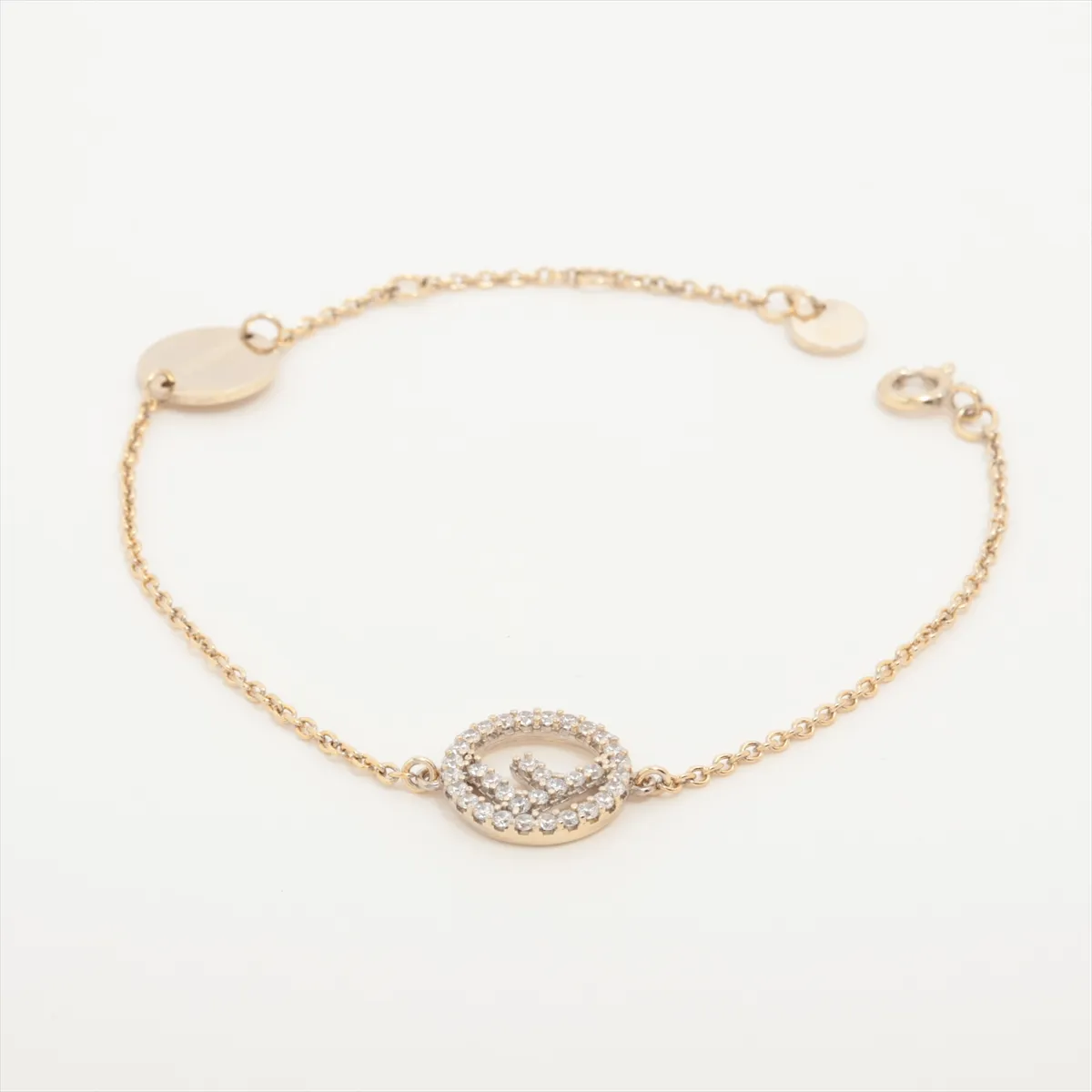 F is Fendi bracelet, gold plated with rhinestones. Shows signs of wear,
