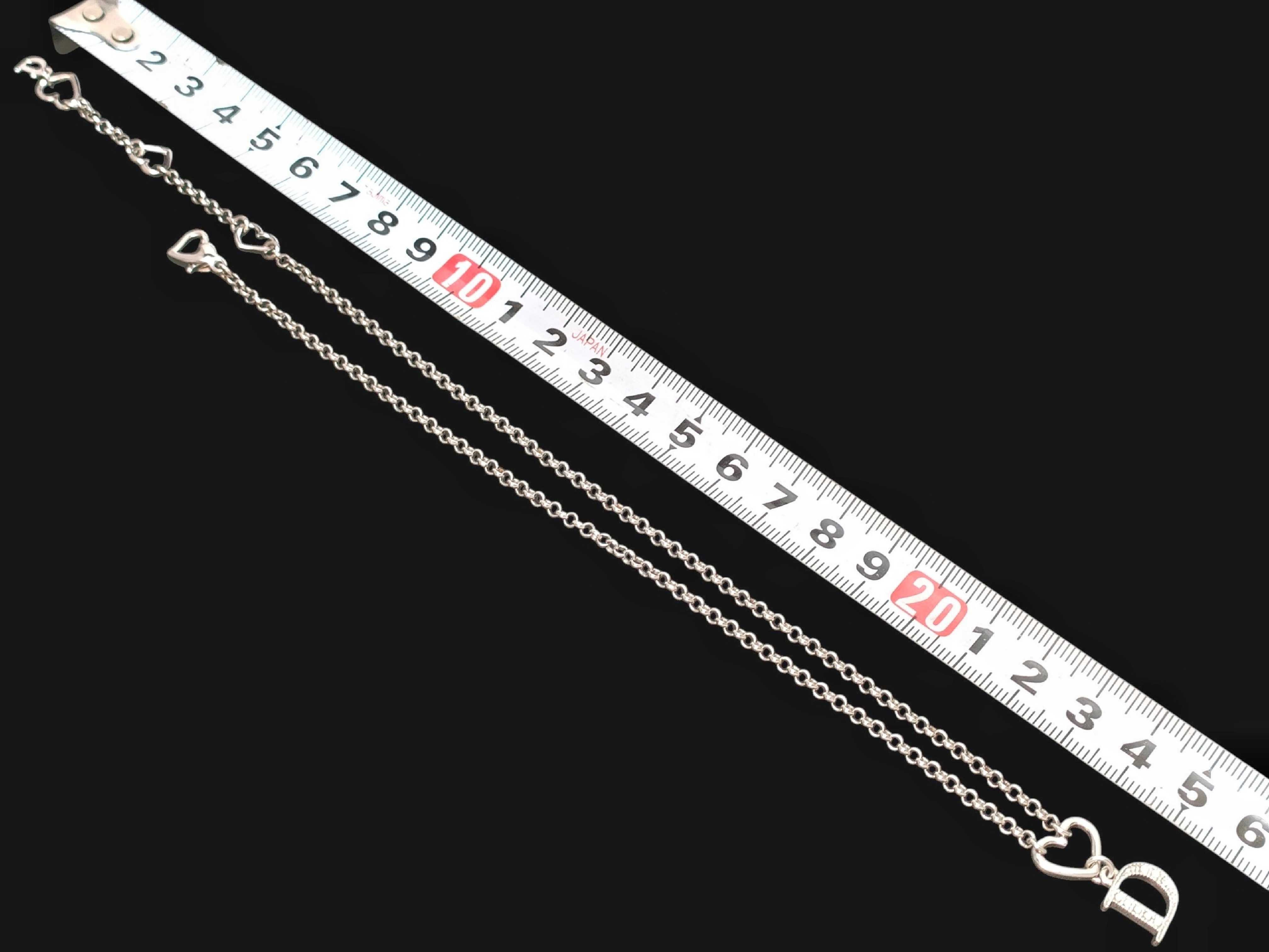 Silver-colored rhinestone-embellished logo and heart motif pendant necklace, 6.52g. — view 7