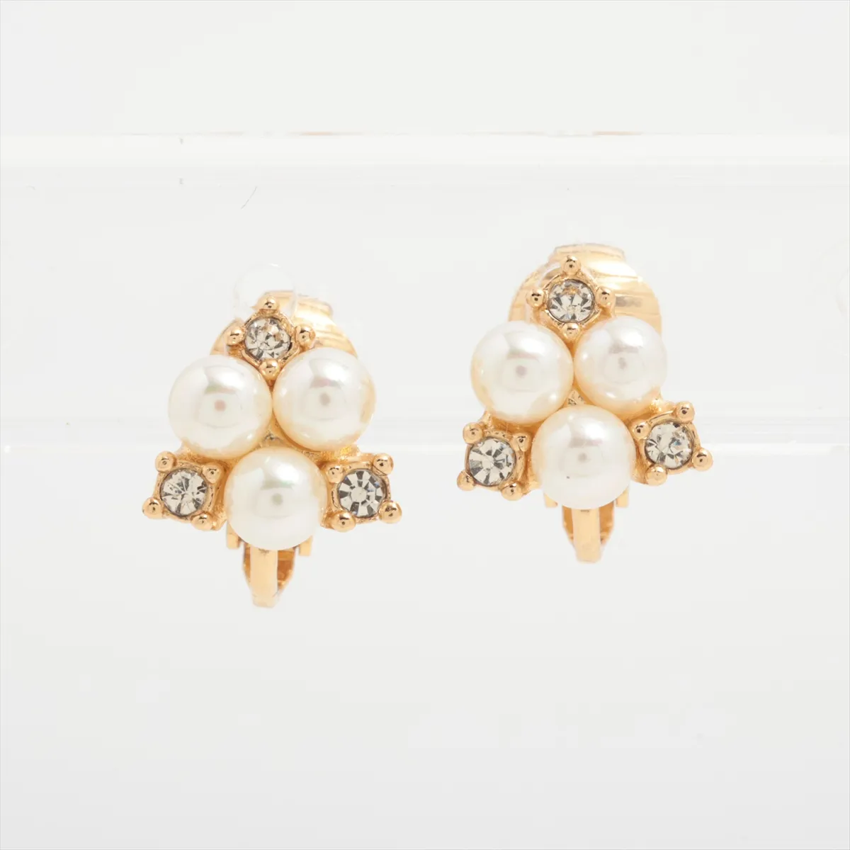 earrings (for both ears), gold-plated with rhinestones and faux pearls. There are