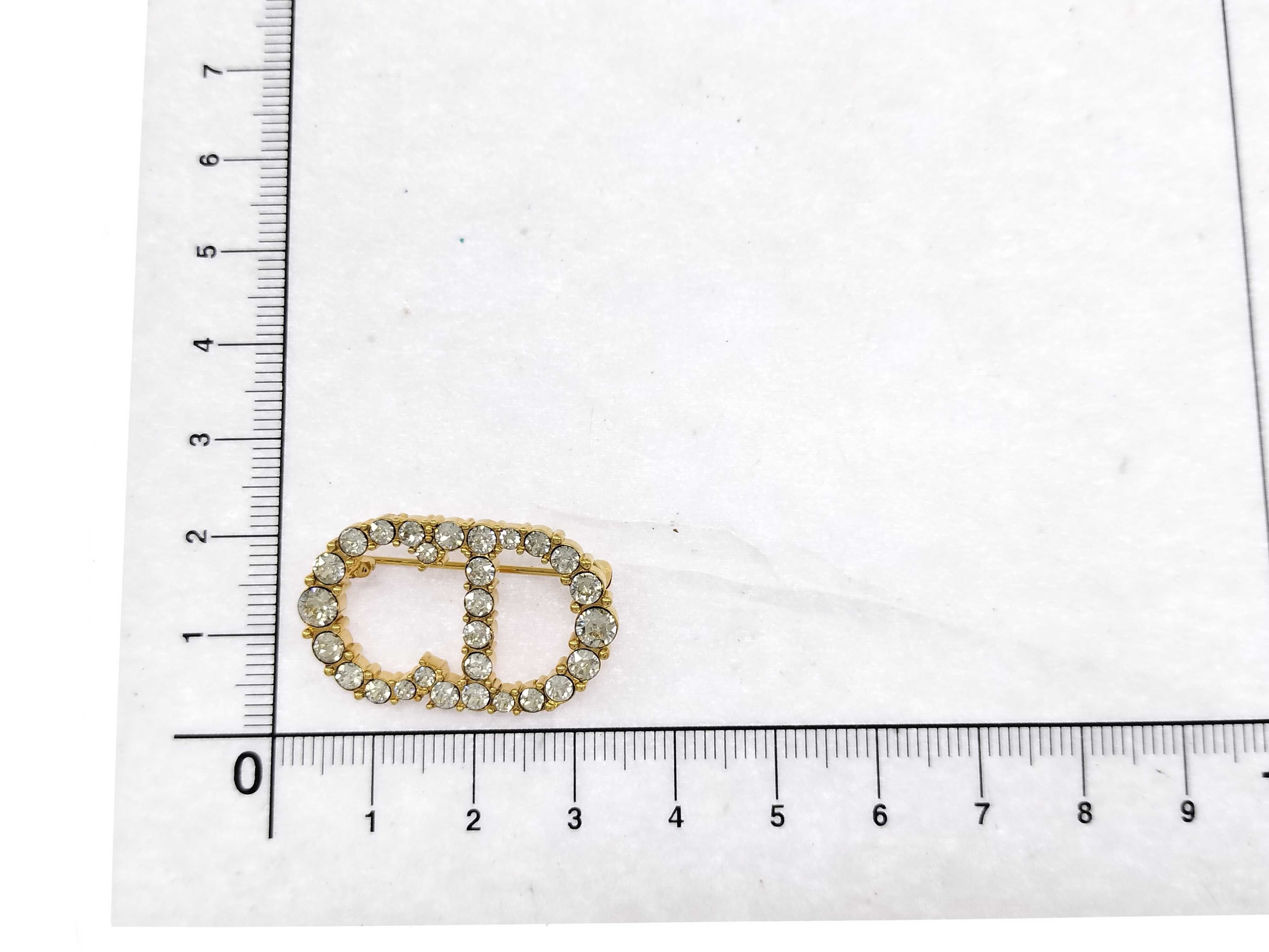 brooch with rhinestones and CD logo, gold. — view 10