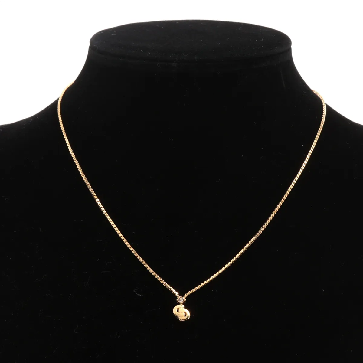 CD logo necklace, gold plated with rhinestones. Shows signs of wear, tarnishing, — view 5
