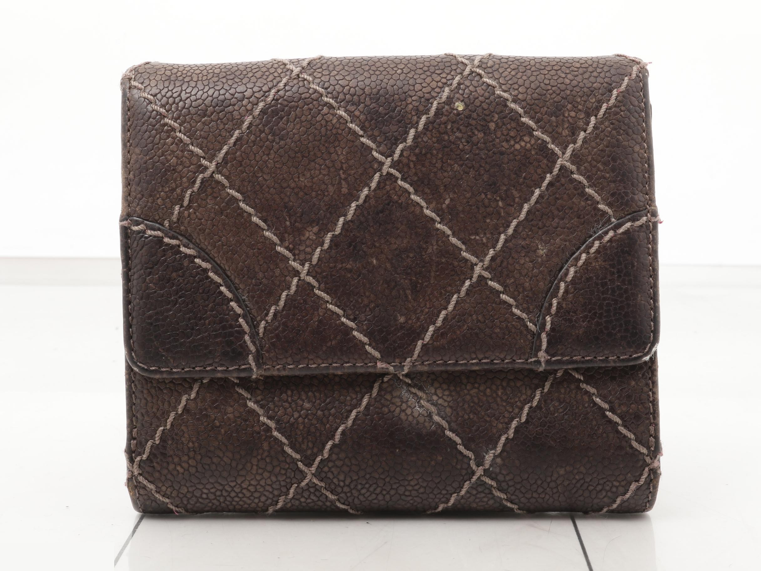 Tri-fold wallet, with sticker, serial number in the teens. — view 2